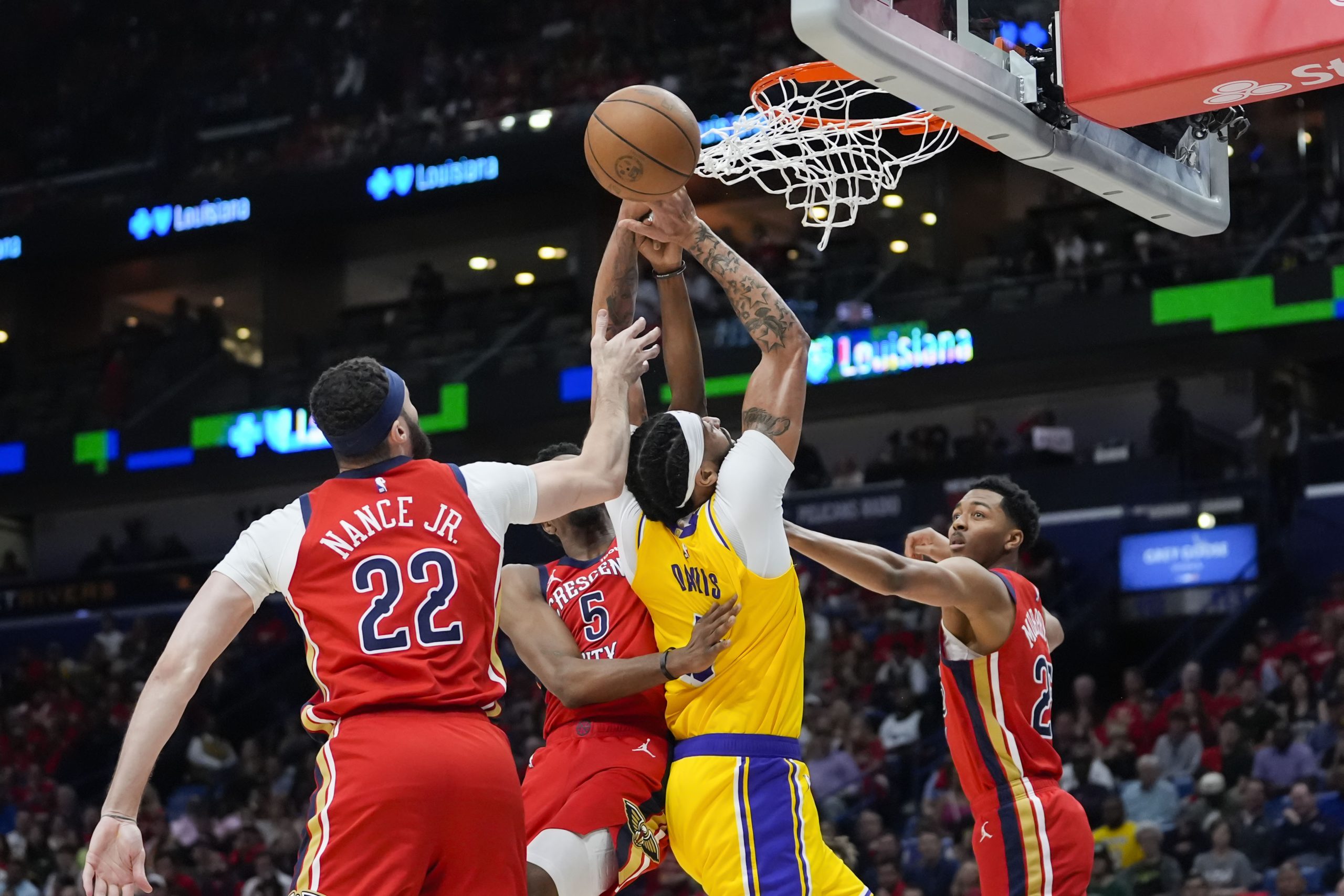Lakers forward Anthony Davis battles under the basket between New...