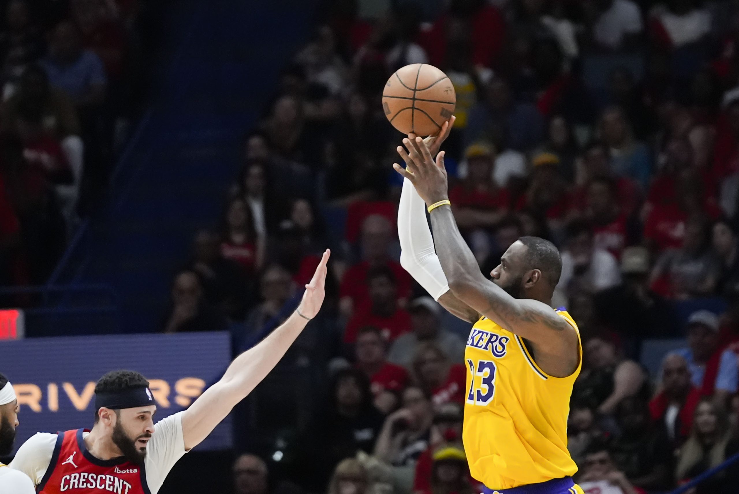 Lakers star LeBron James shoots against New Orleans Pelicans forward...