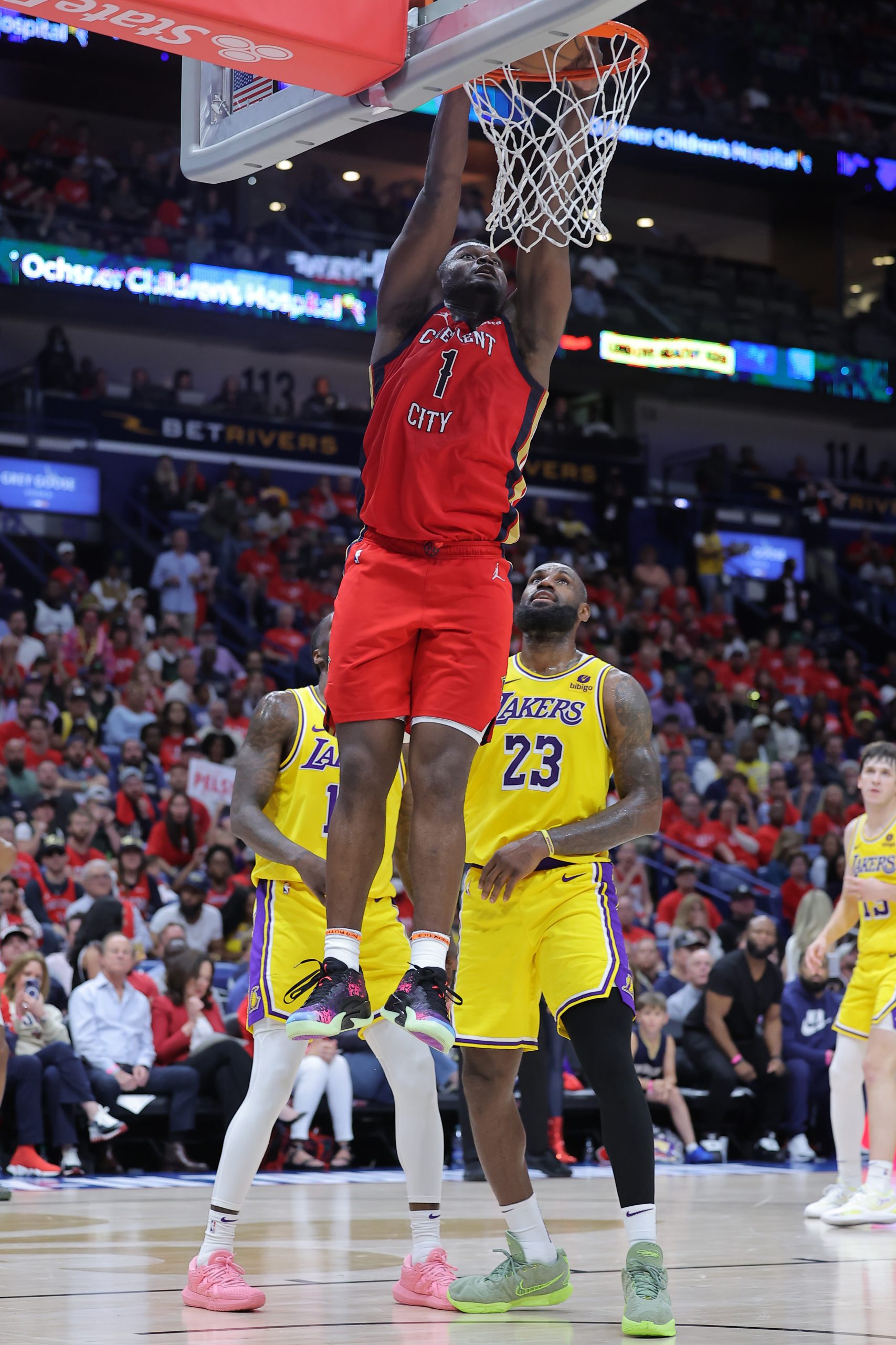 New Orleans Pelicans star Zion Williamson dunks in front of...