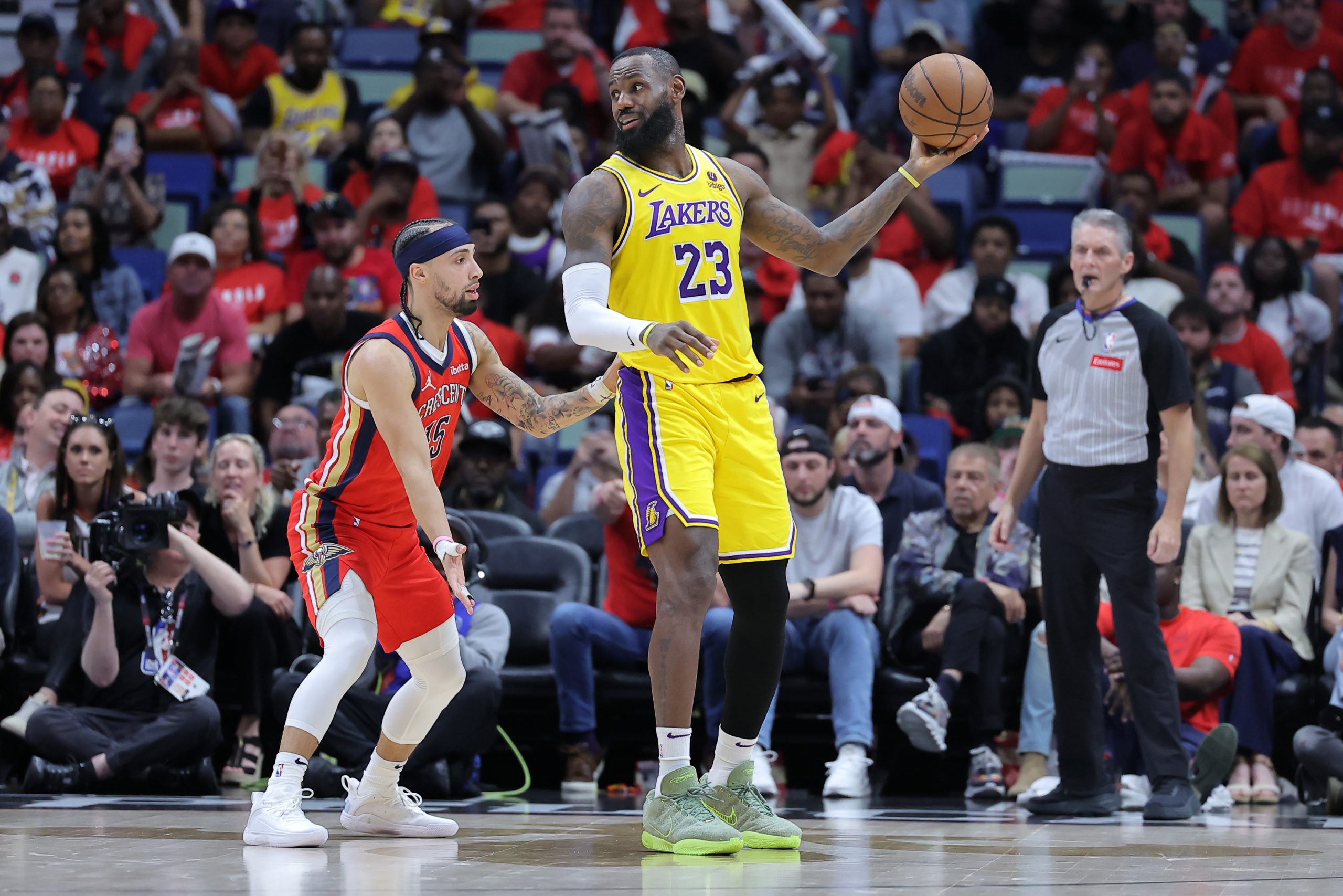 Lakers star LeBron James posts up against the New Orleans...