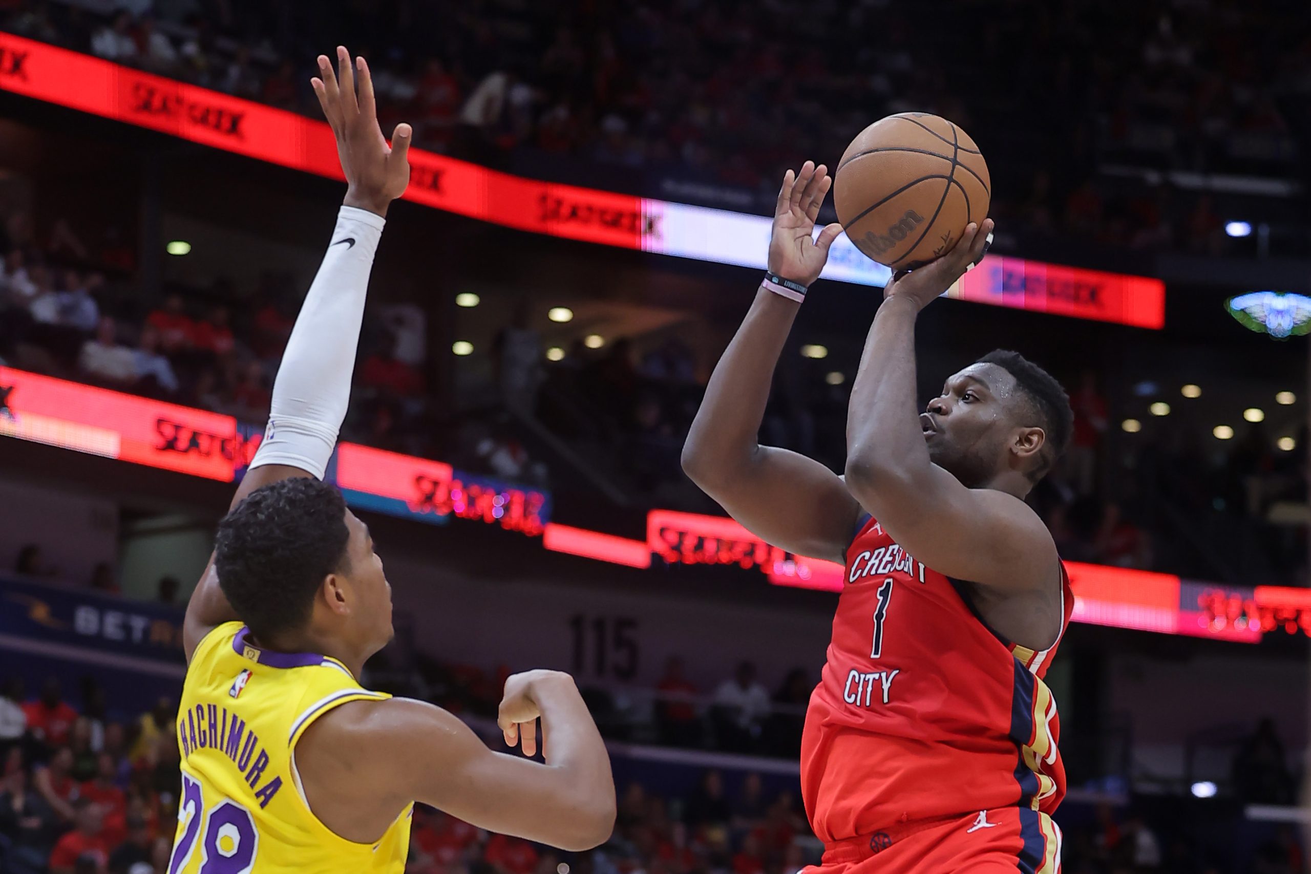 New Orleans Pelicans star Zion Williamson shoots as Lakers forward...