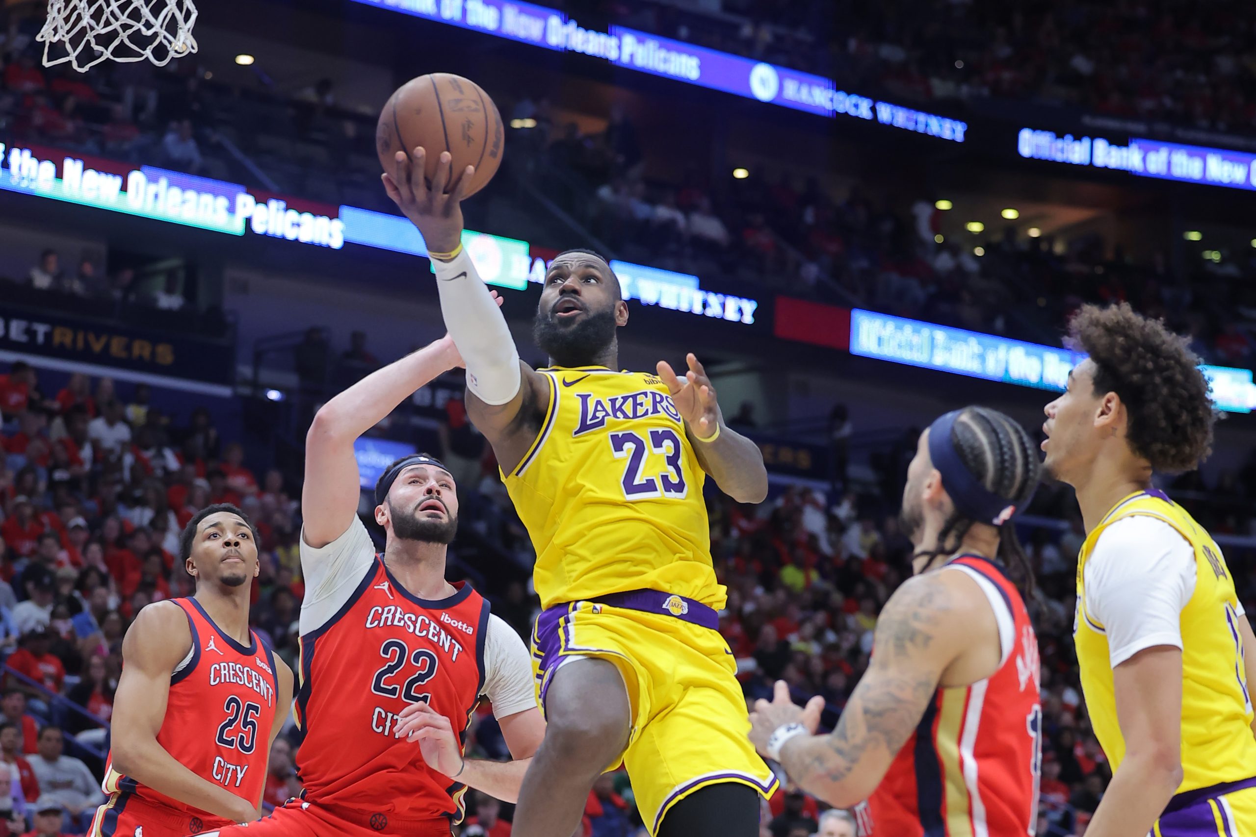 Lakers star LeBron James shoots over New Orleans Pelicans forward...