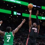 Apr 24, 2024; Boston, Massachusetts, USA; Miami Heat center Bam Adebayo (13) shoots against Boston Celtics guard Jaylen Brown (7) in the first quarter during game two of the first round for the 2024 NBA playoffs at TD Garden. Mandatory Credit: David Butler II-USA TODAY Sports