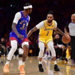 Apr 25, 2024; Los Angeles, California, USA; Los Angeles Lakers guard D'Angelo Russell (1) moves the ball against Denver Nuggets guard Kentavious Caldwell-Pope (5) during the second half in game three of the first round for the 2024 NBA playoffs at Crypto.com Arena. Mandatory Credit: Gary A. Vasquez-USA TODAY Sports