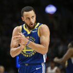 Golden State Warriors guard Stephen Curry (30) claps his hands in celebration during the second half against the Portland Trail Blazers at Moda Center.