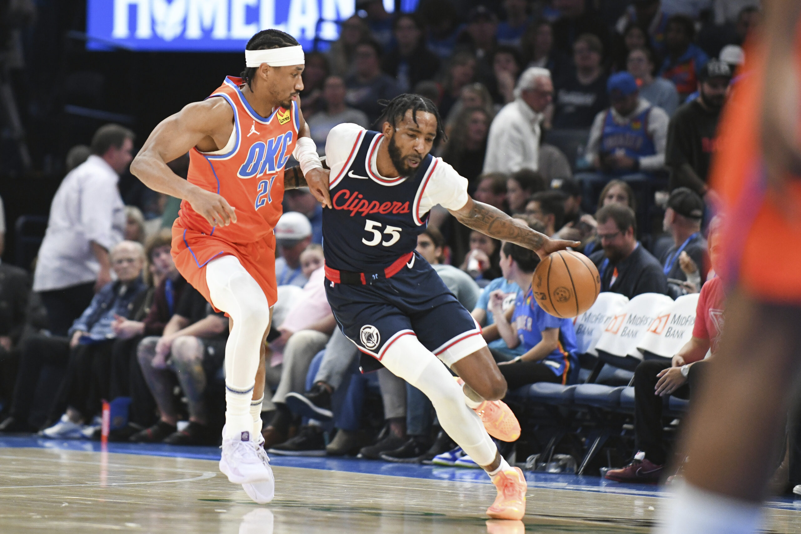 Clippers forward Derrick Jones Jr., right, pushes past Oklahoma City...