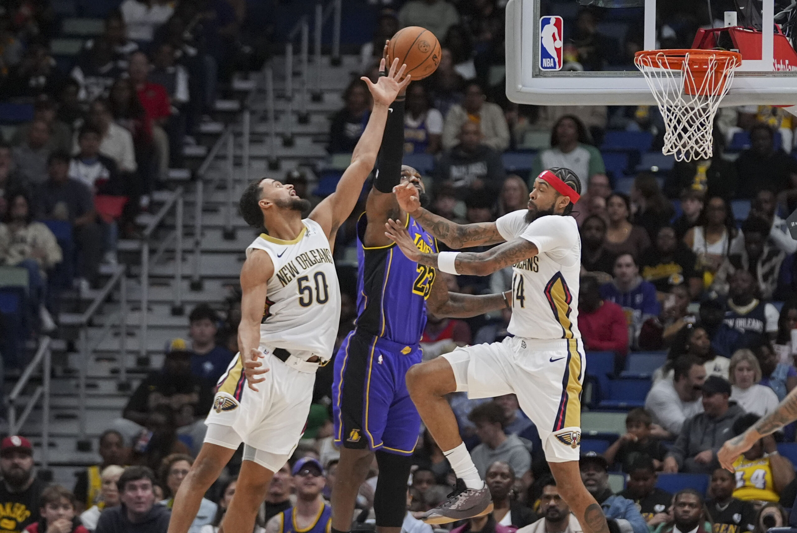 Lakers forward LeBron James (23) leaps for a rebound against...