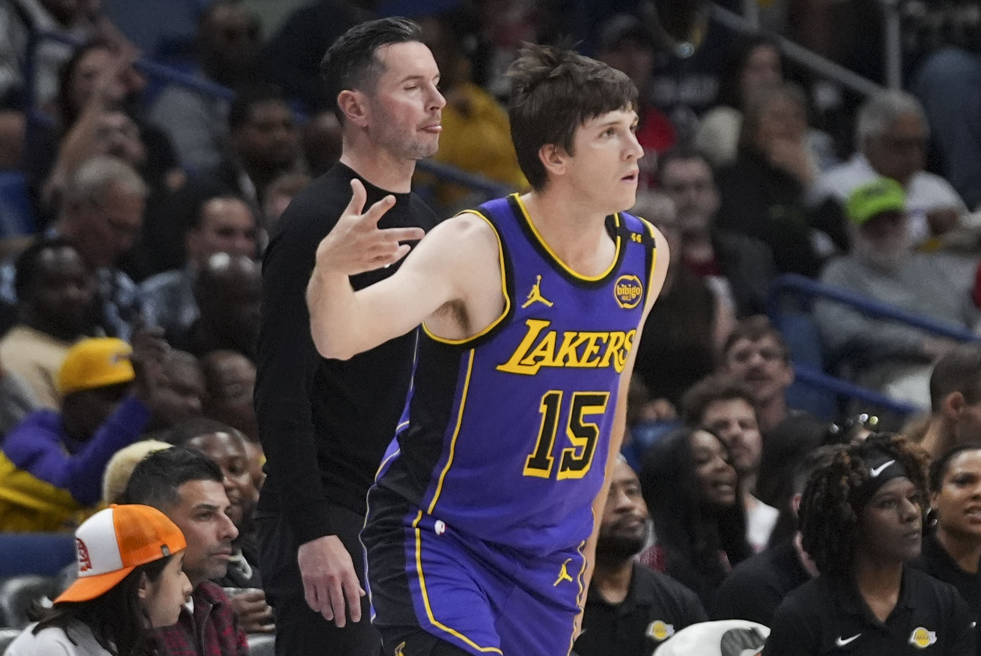 Lakers guard Austin Reaves (15) reacts after making a 3-point...