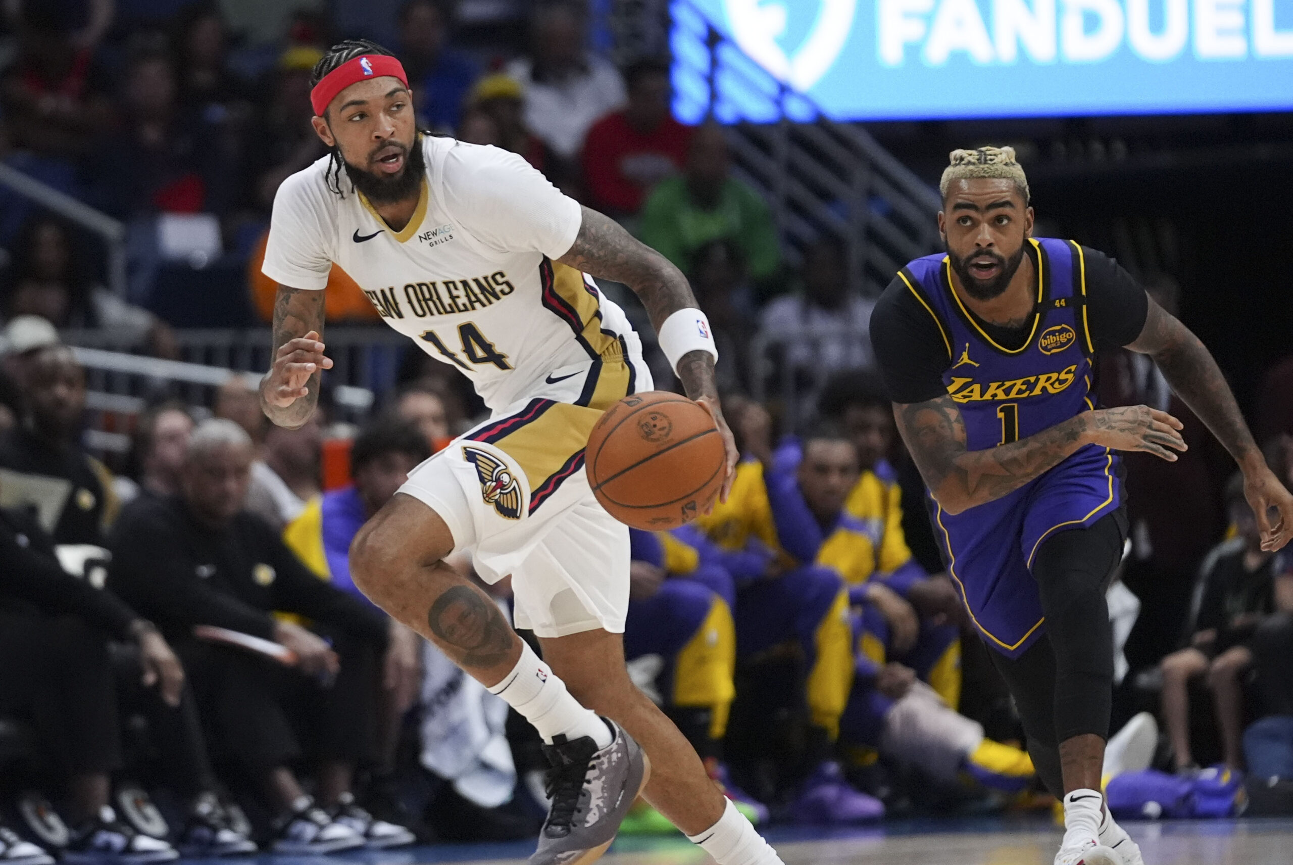 New Orleans Pelicans forward Brandon Ingram (14) moves the ball...