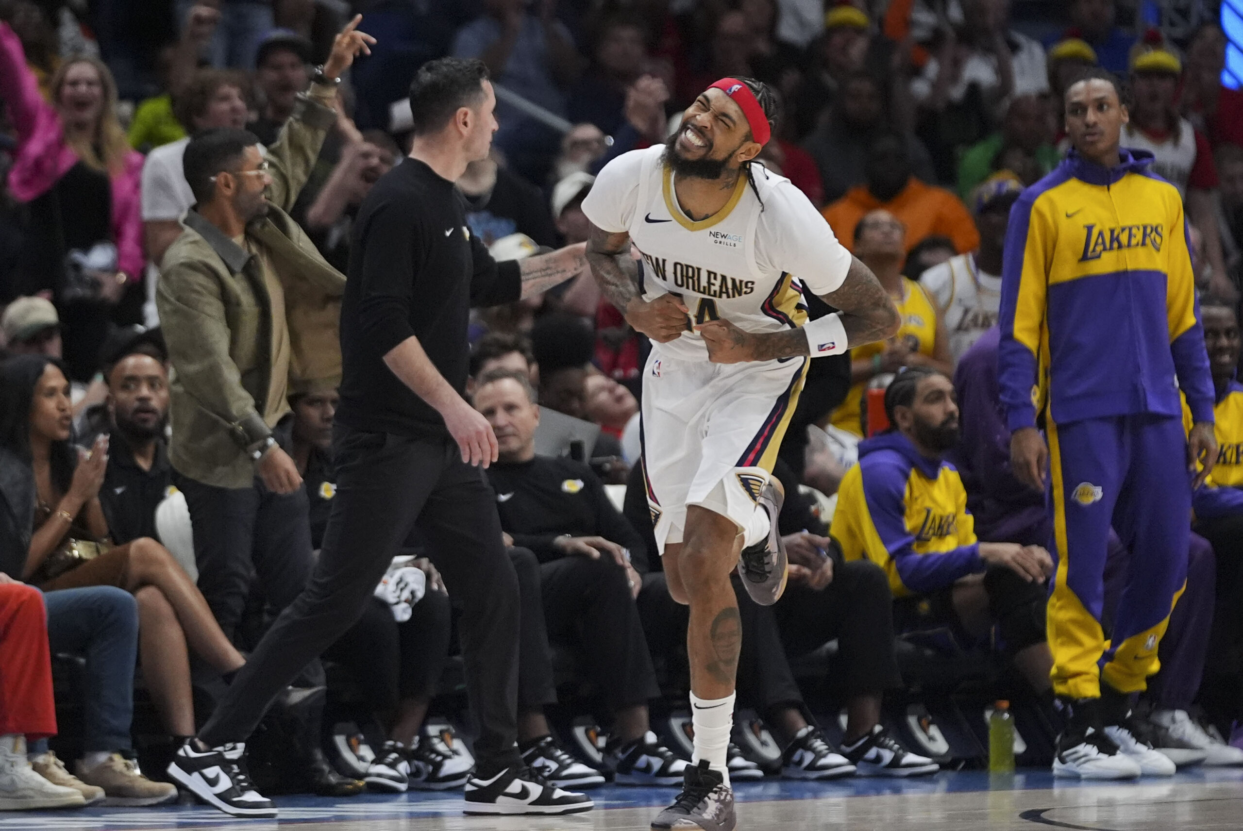 New Orleans Pelicans forward Brandon Ingram (14)celebrates after making a...