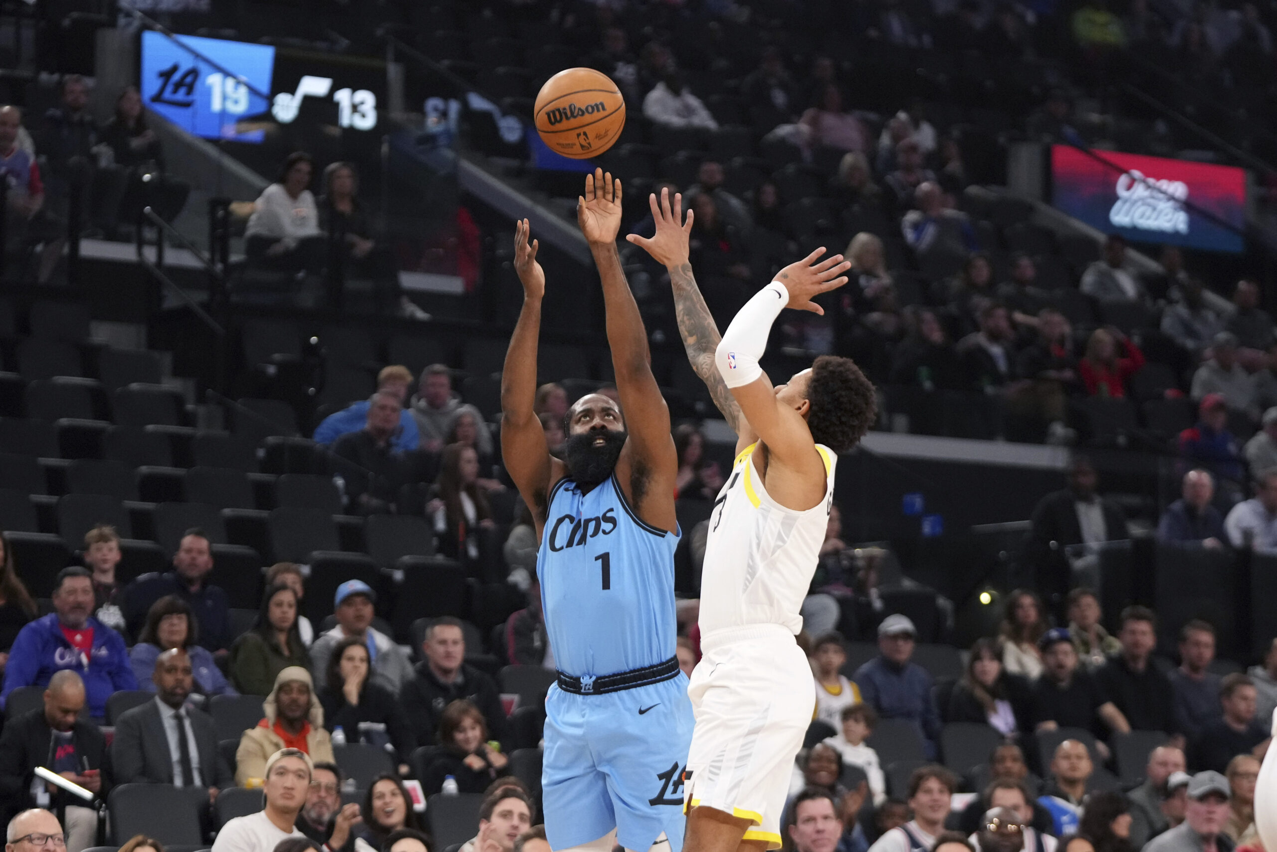 Clippers guard James Harden, left, shoots as Utah Jazz guard...