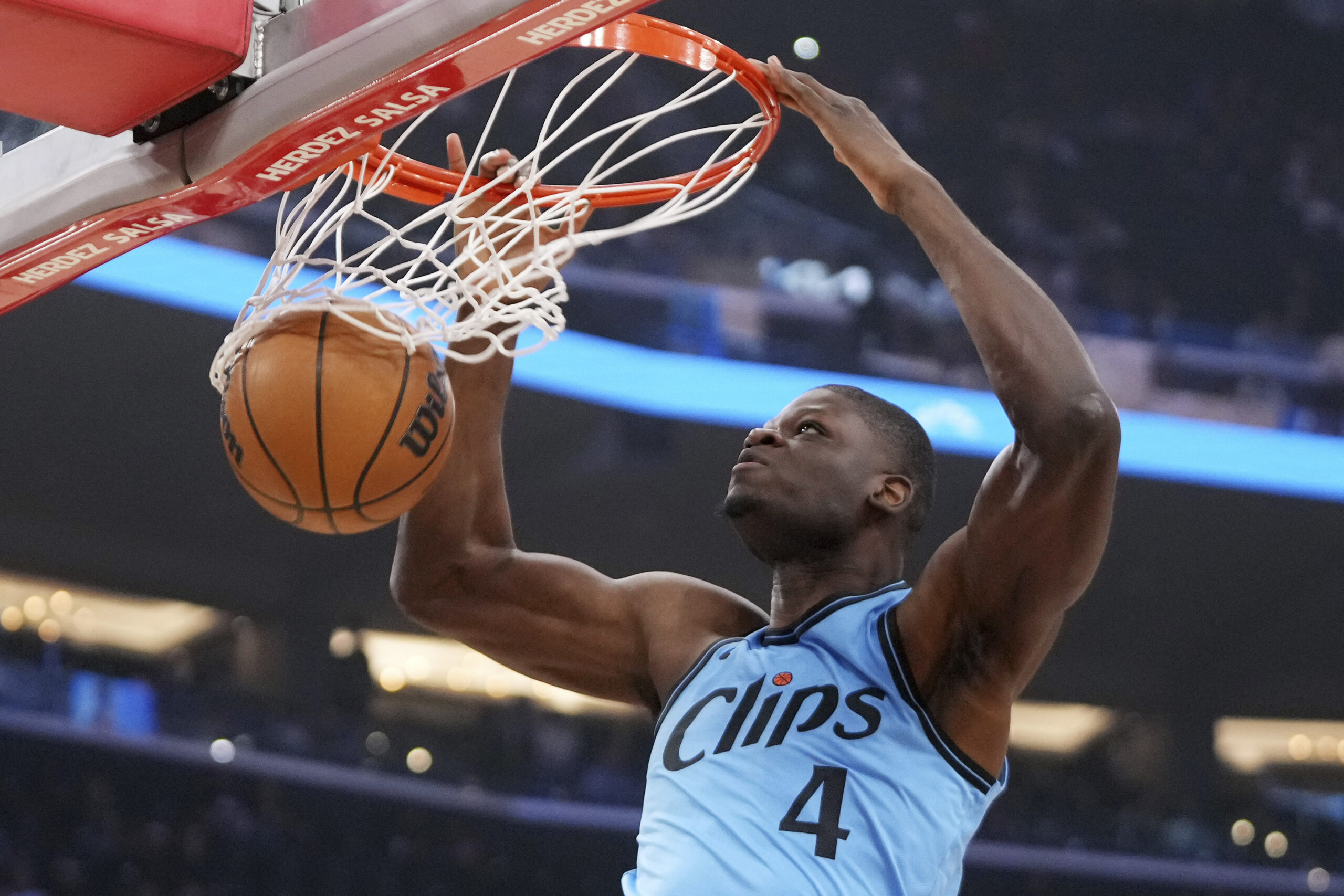 Clippers center Mo Bamba dunks during the first half of...