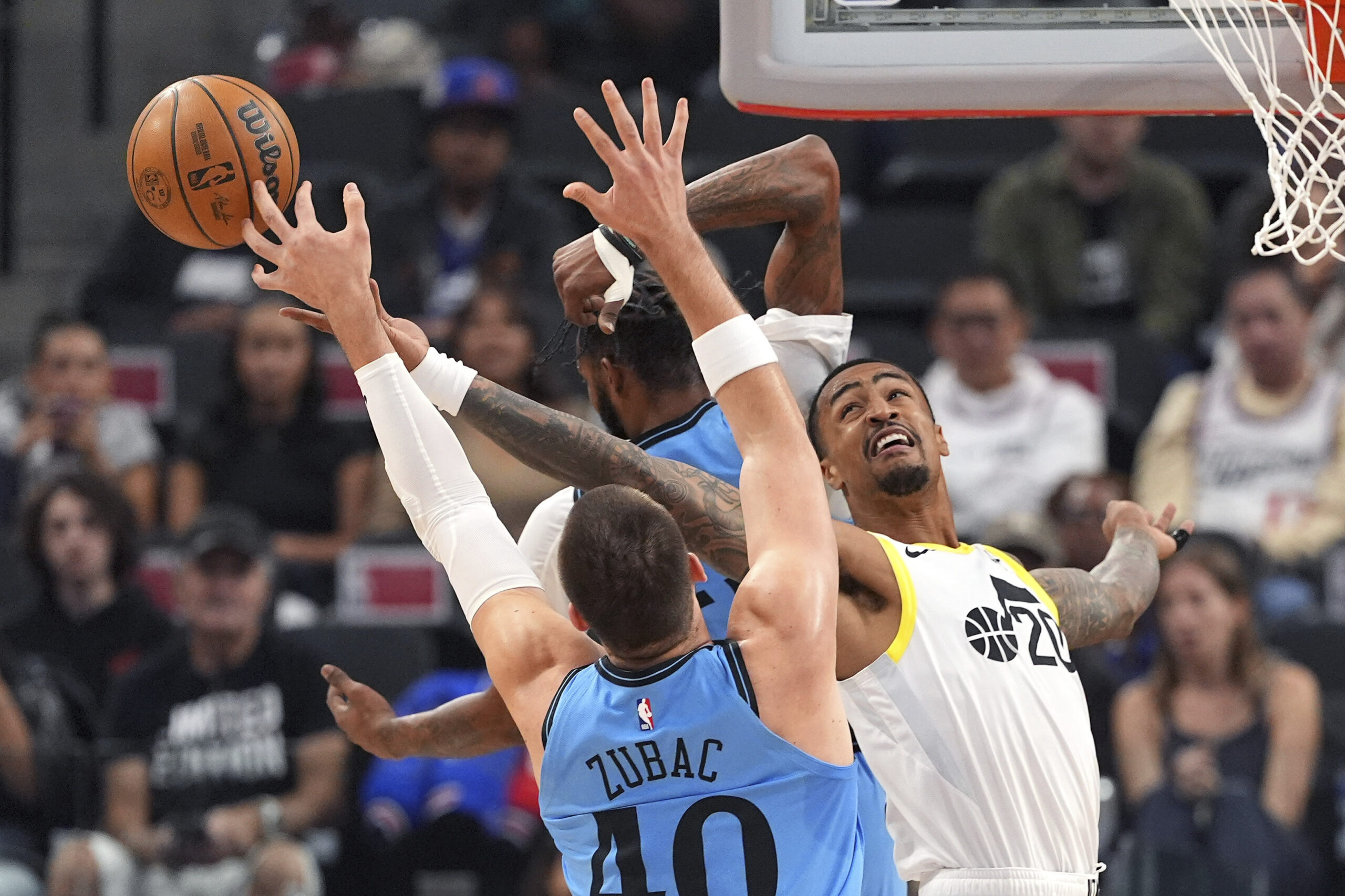 Utah Jazz forward John Collins, right, and Clippers center Ivica...