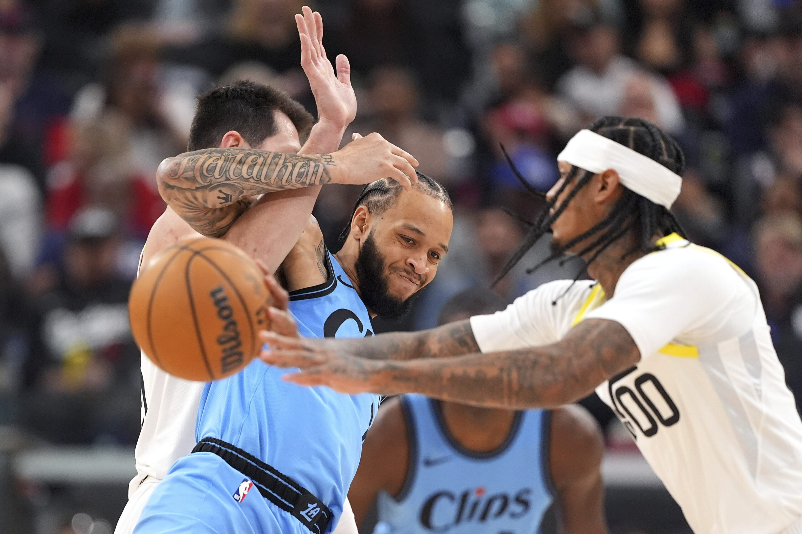 Utah Jazz guard Jordan Clarkson, right, passes the ball as...