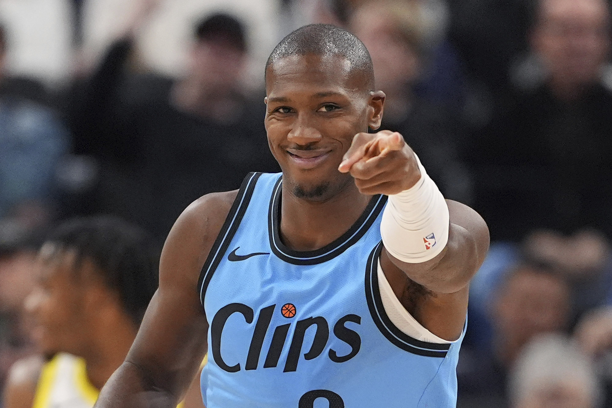 Clippers guard Kris Dunn gestures after scoring during the second...