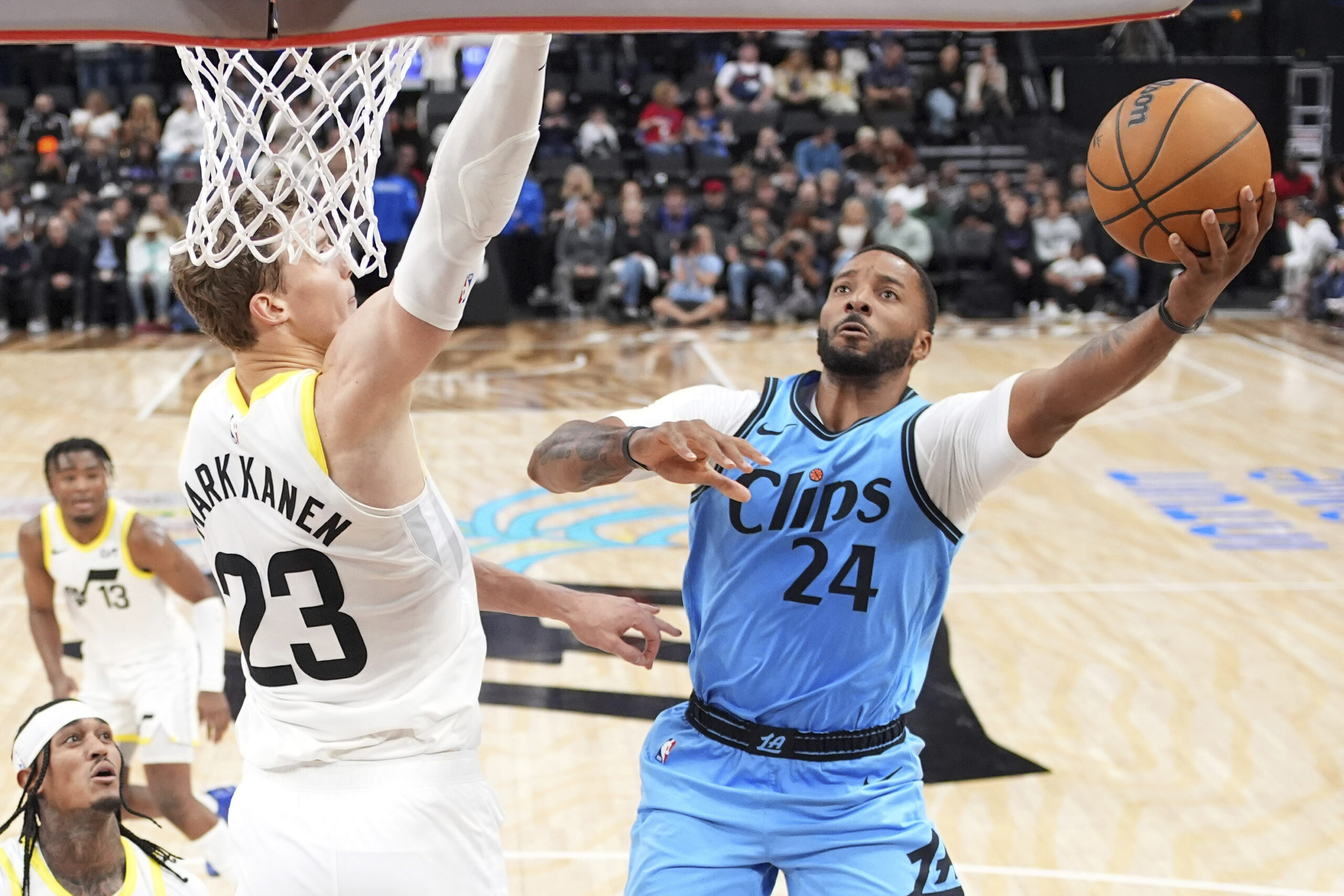 Clippers guard Norman Powell, right, shoots as Utah Jazz forward...