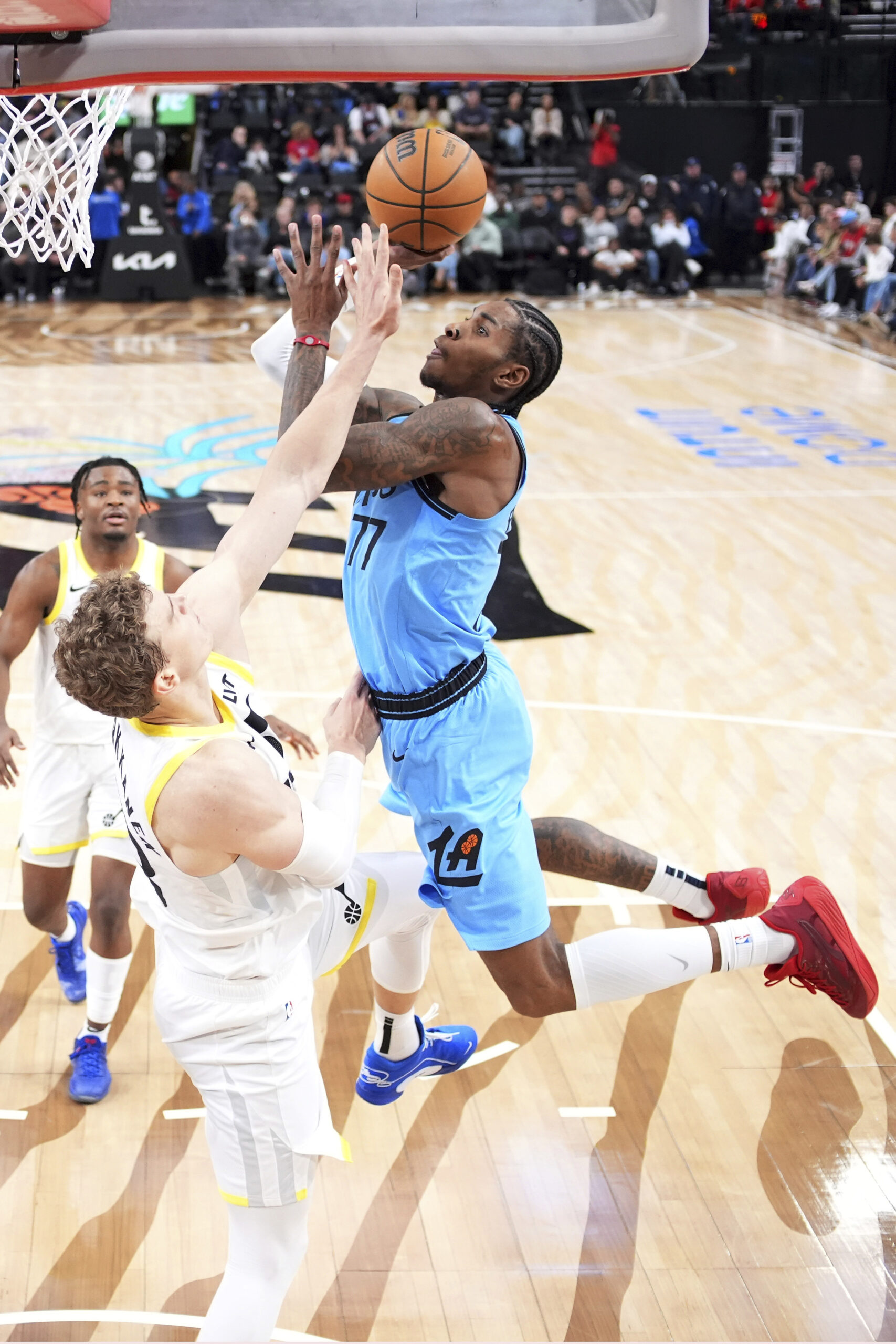 Clippers guard Kevin Porter Jr., right, shoots as Utah Jazz...