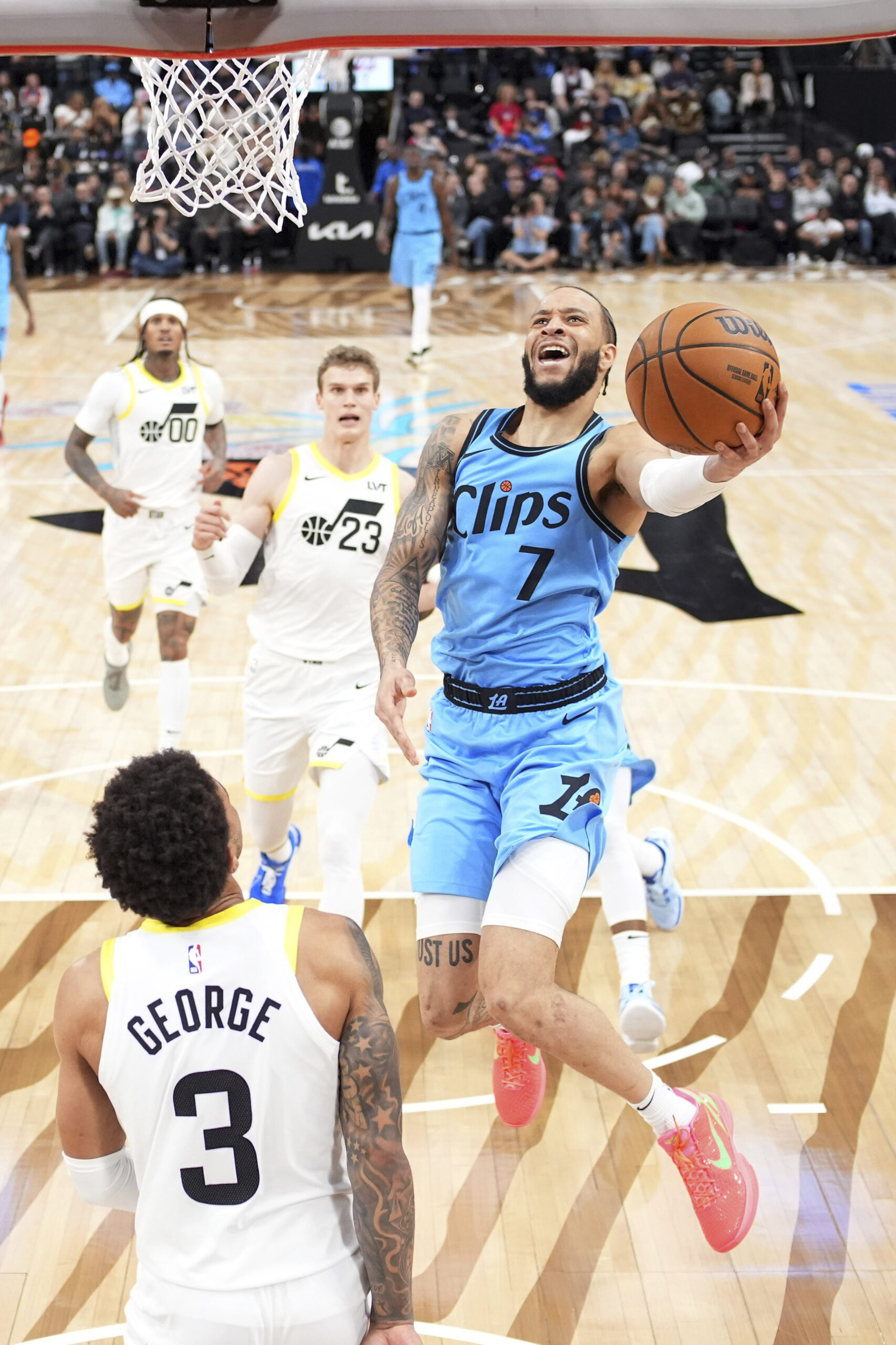 Clippers guard Amir Coffey, right, shoots as Utah Jazz guard...