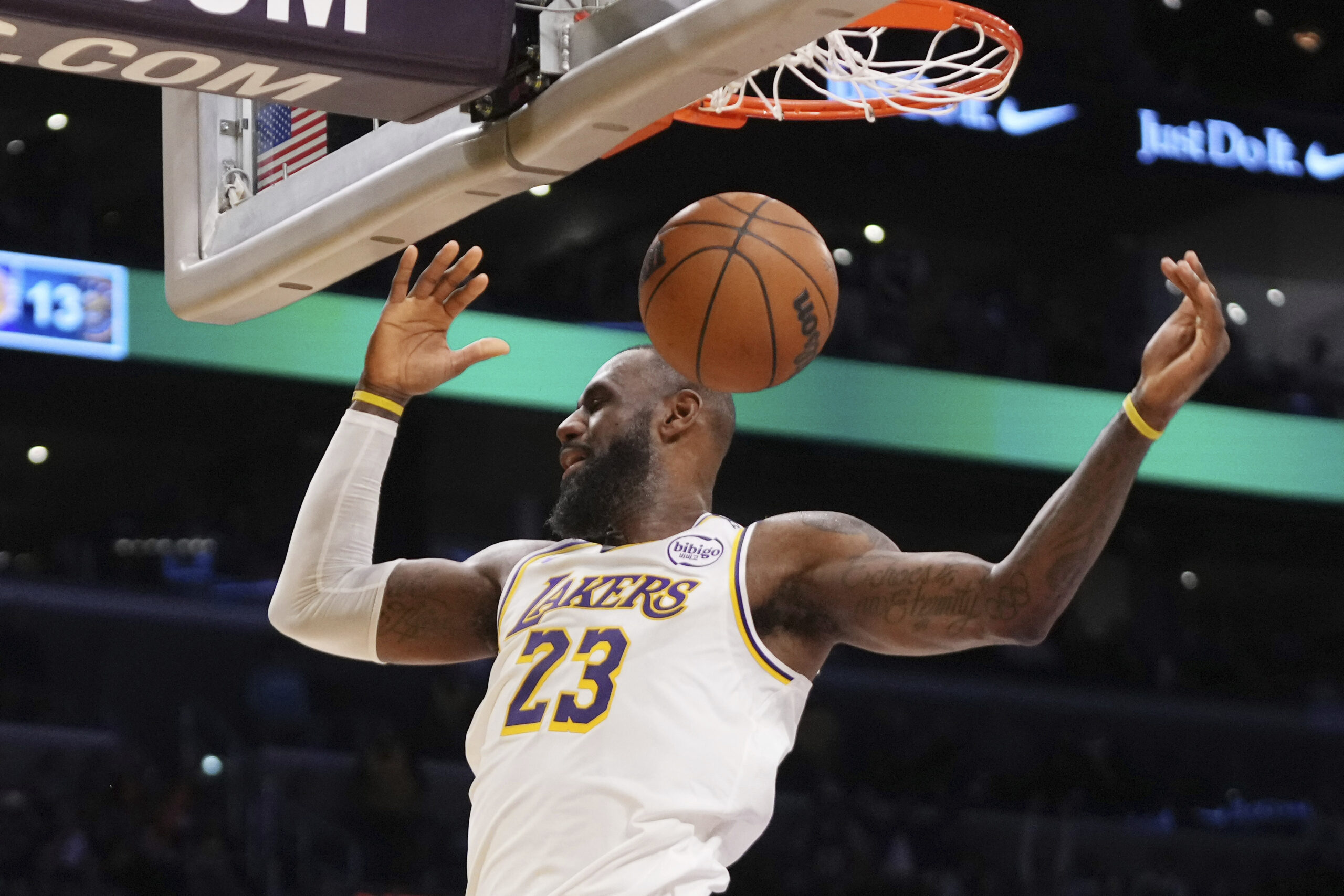 Lakers forward LeBron James dunks during the first half of...