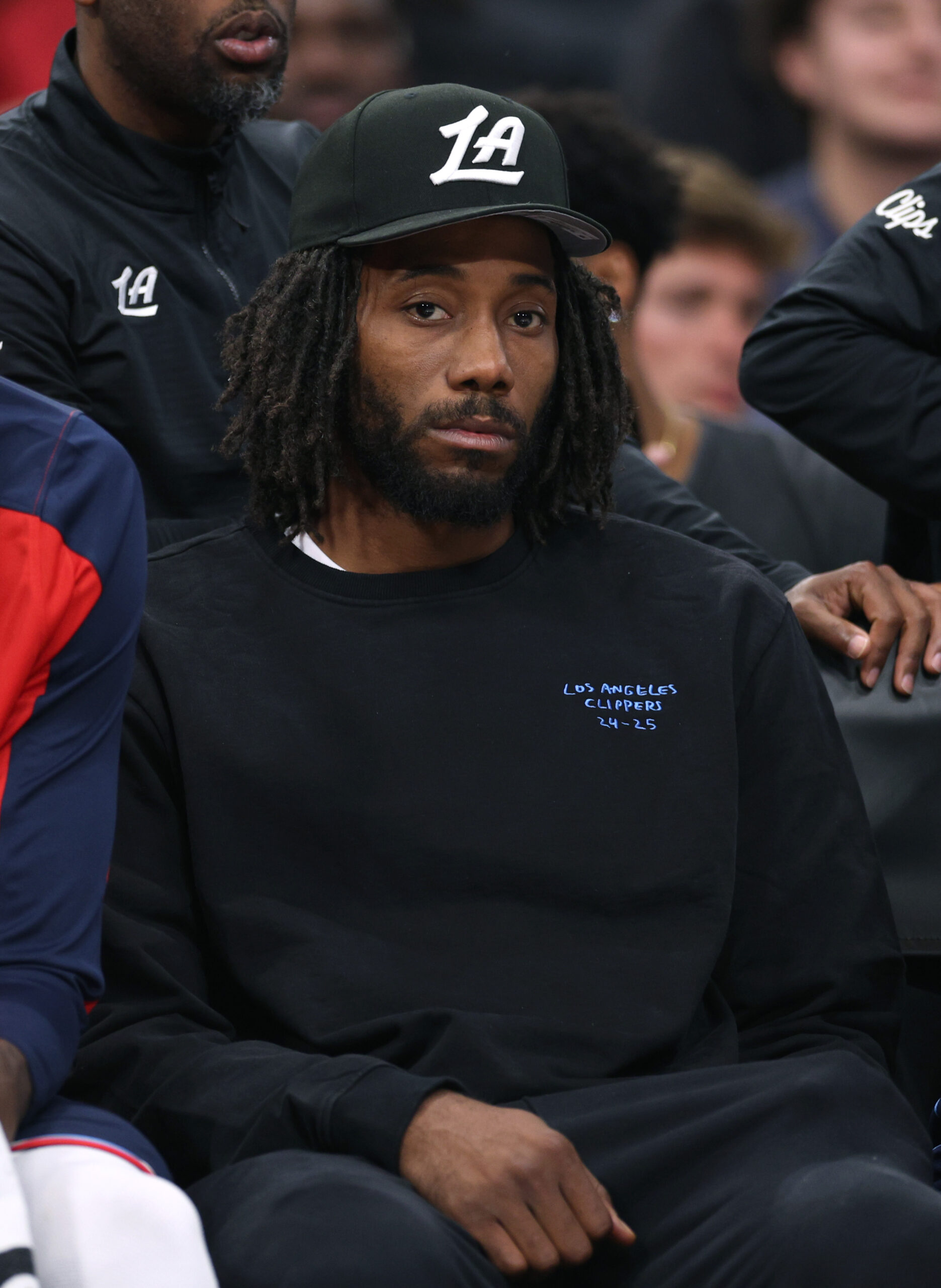 Injured Clippers star Kawhi Leonard watches from the bench during...