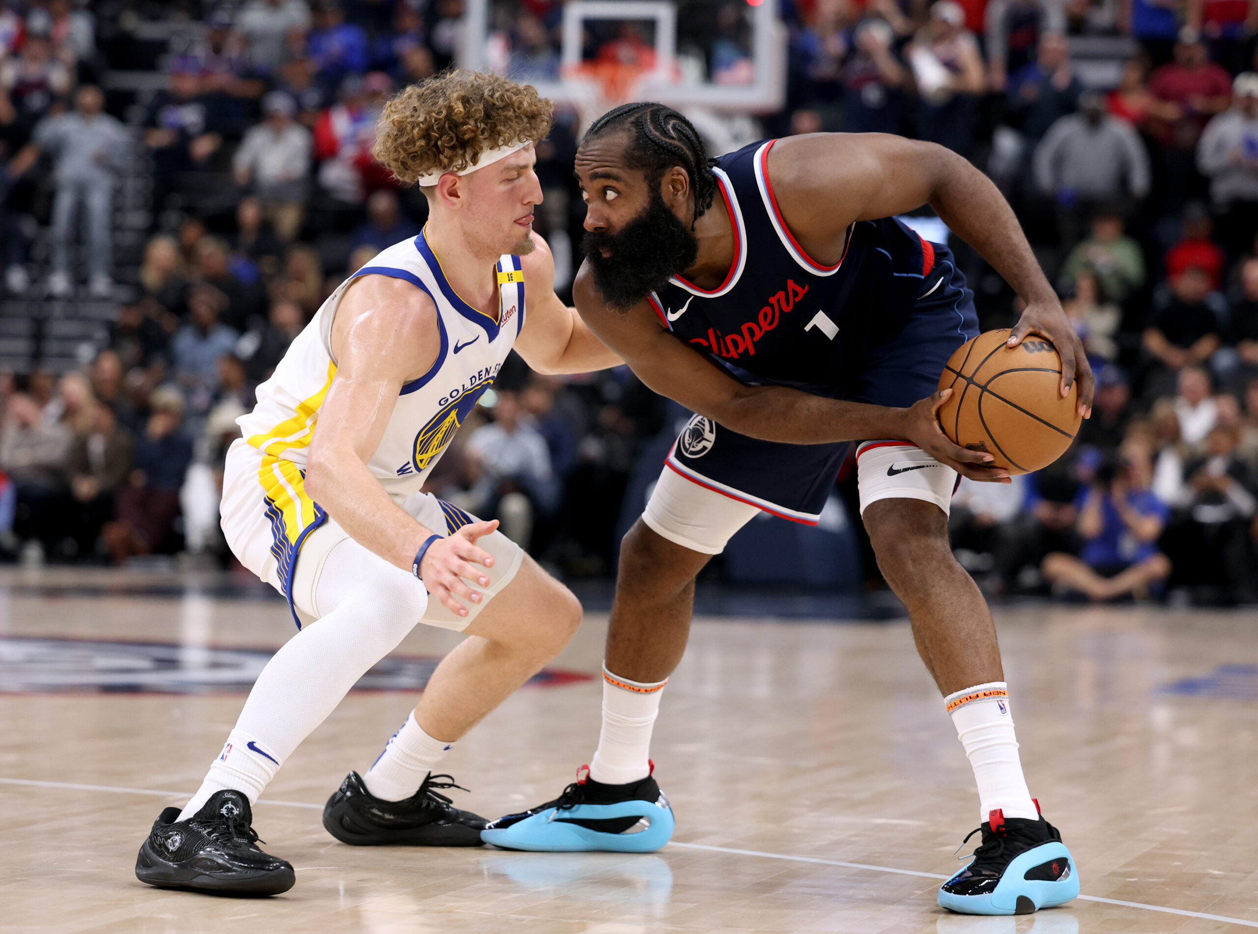 Clippers guard James Harden handles the ball as the Golden...