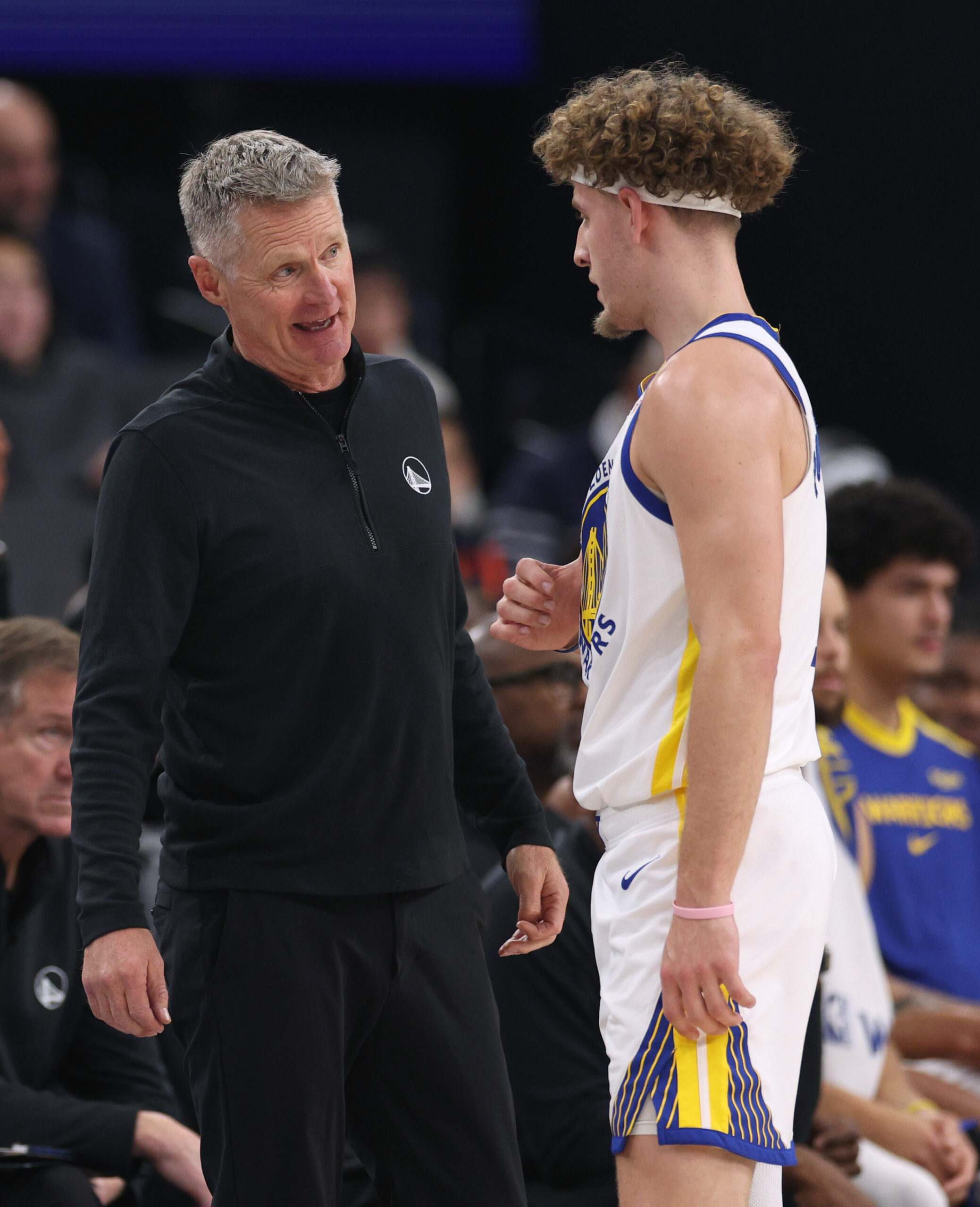 Golden State Warriors coach Steve Kerr, left, talks with Brandin...