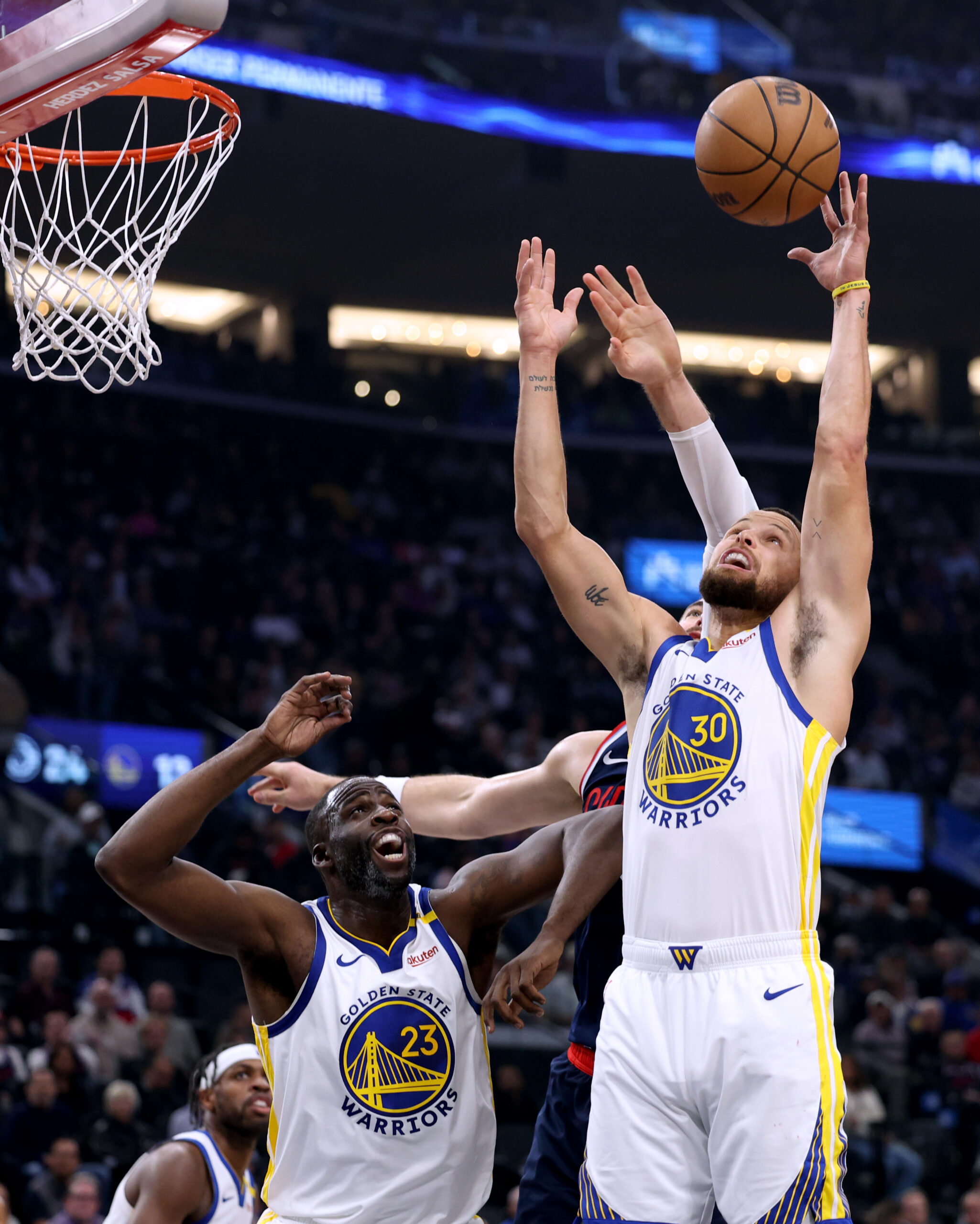 Golden State Warriors guard Steph Curry grabs a rebound in...