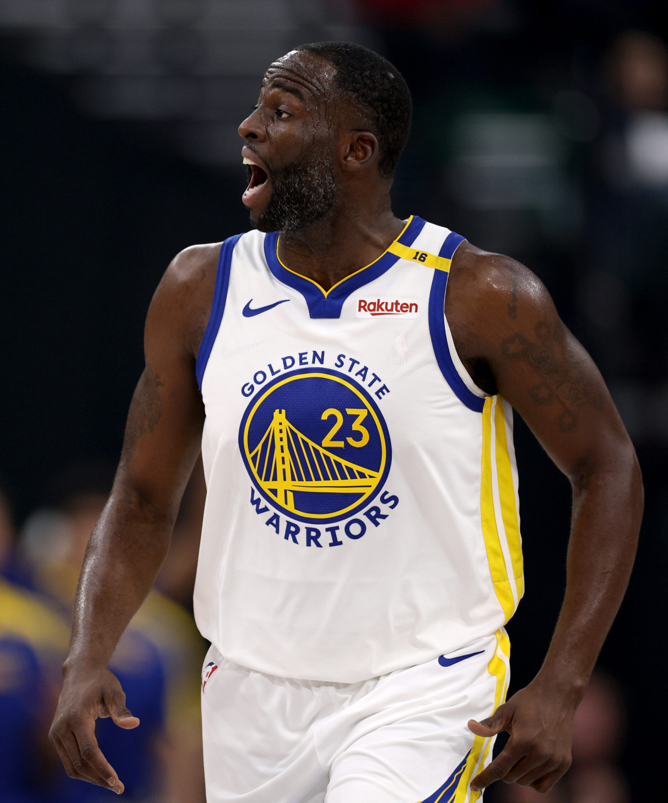 Golden State Warriors forward Draymond Green reacts after making a...