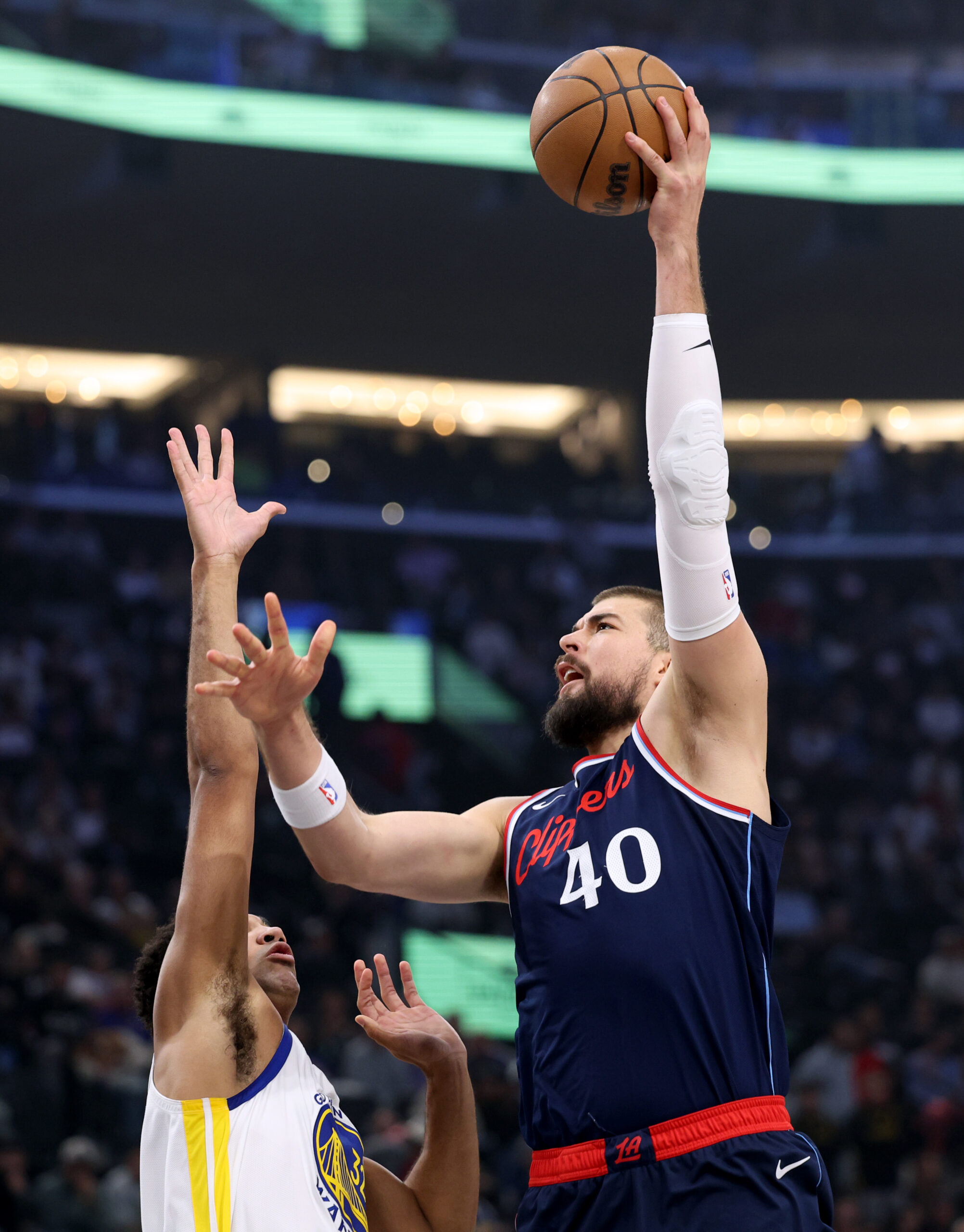 Clippers center Ivica Zubac scores on a shot over the...