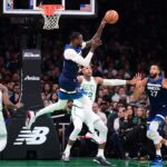 Minnesota Timberwolves forward Julius Randle (30) passes the ball during the first half against the Boston Celtics