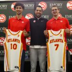 Atlanta Hawks first overall draft pick Zaccharie Risacher and general manager Landry Fields and second round draft pick Nikola Djurisic pose for a photo with jerseys