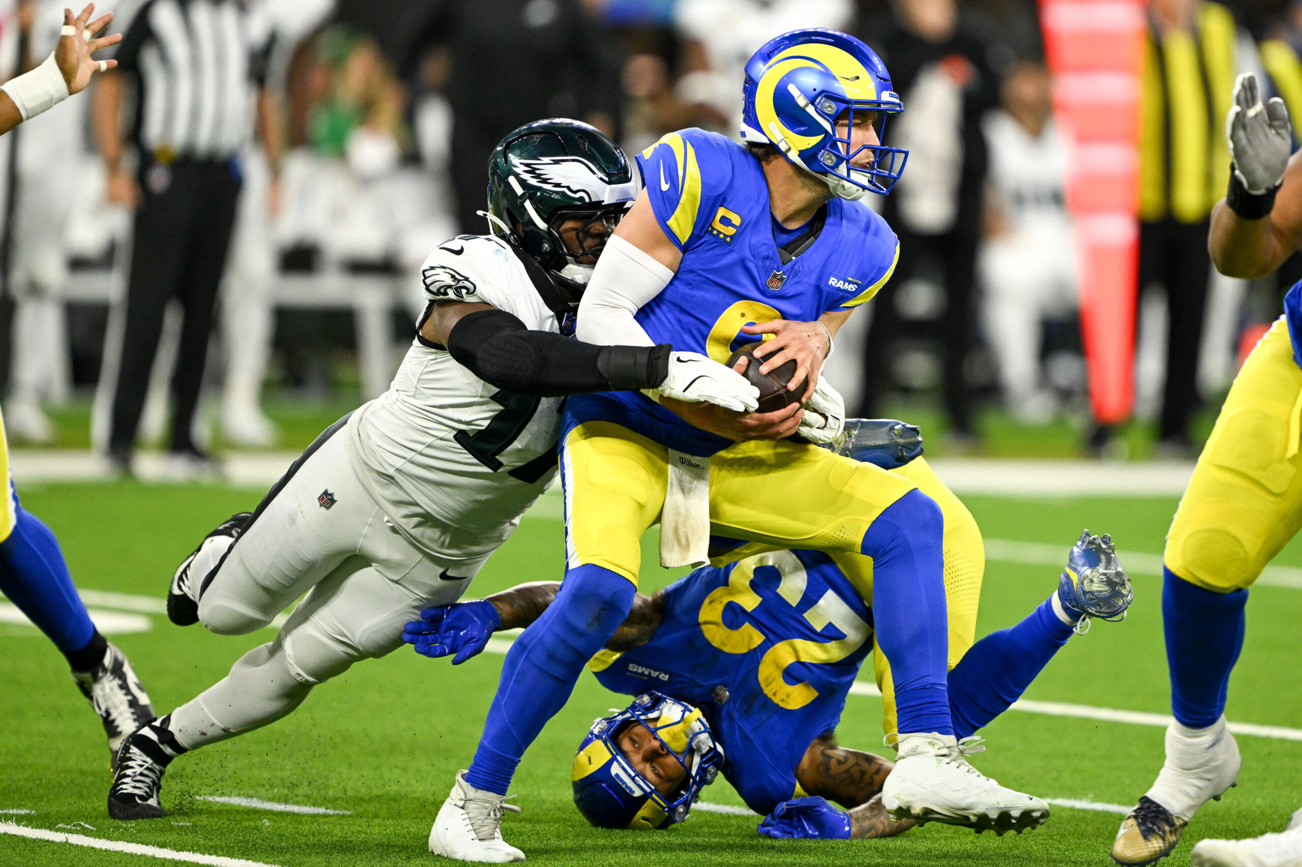 Rams QB Matthew Stafford, #9, gets sacked by Eagles A.J....