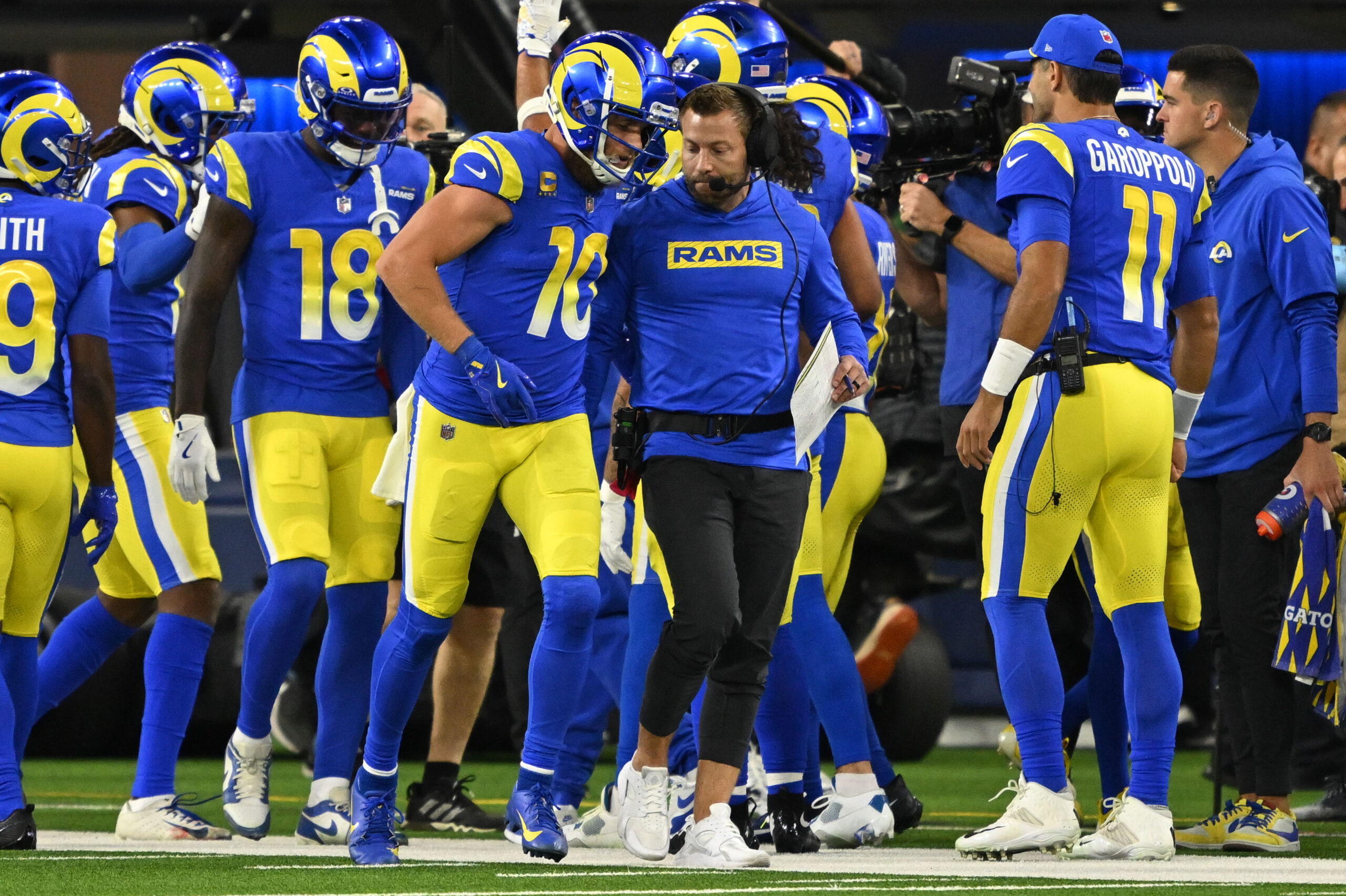 Rams Cooper Kupp, #10, is greeted by head coach Sean...