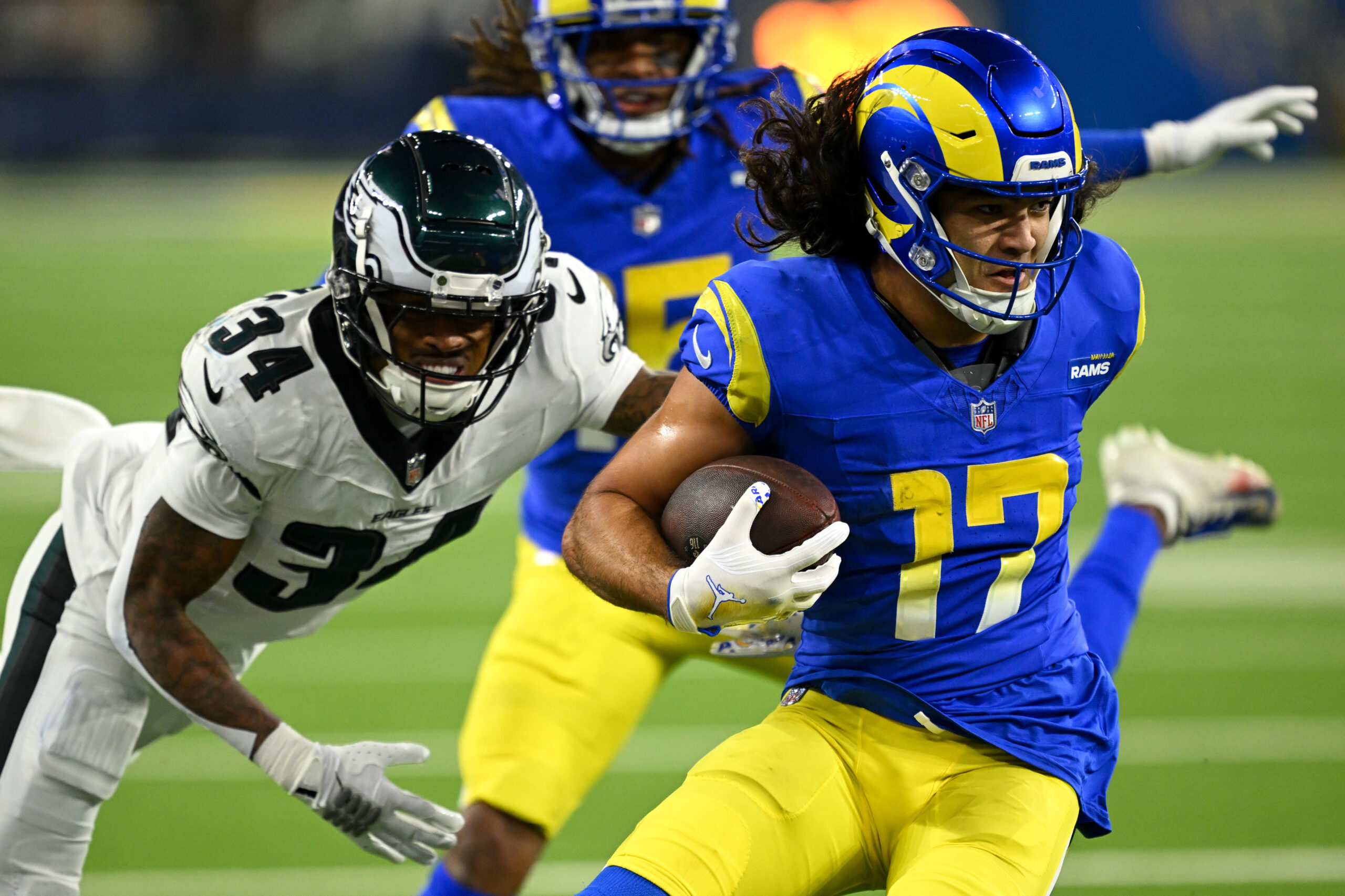 Rams Puka Nacua, #17, eludes Eagles Isaiah Rodgers, #34, for...