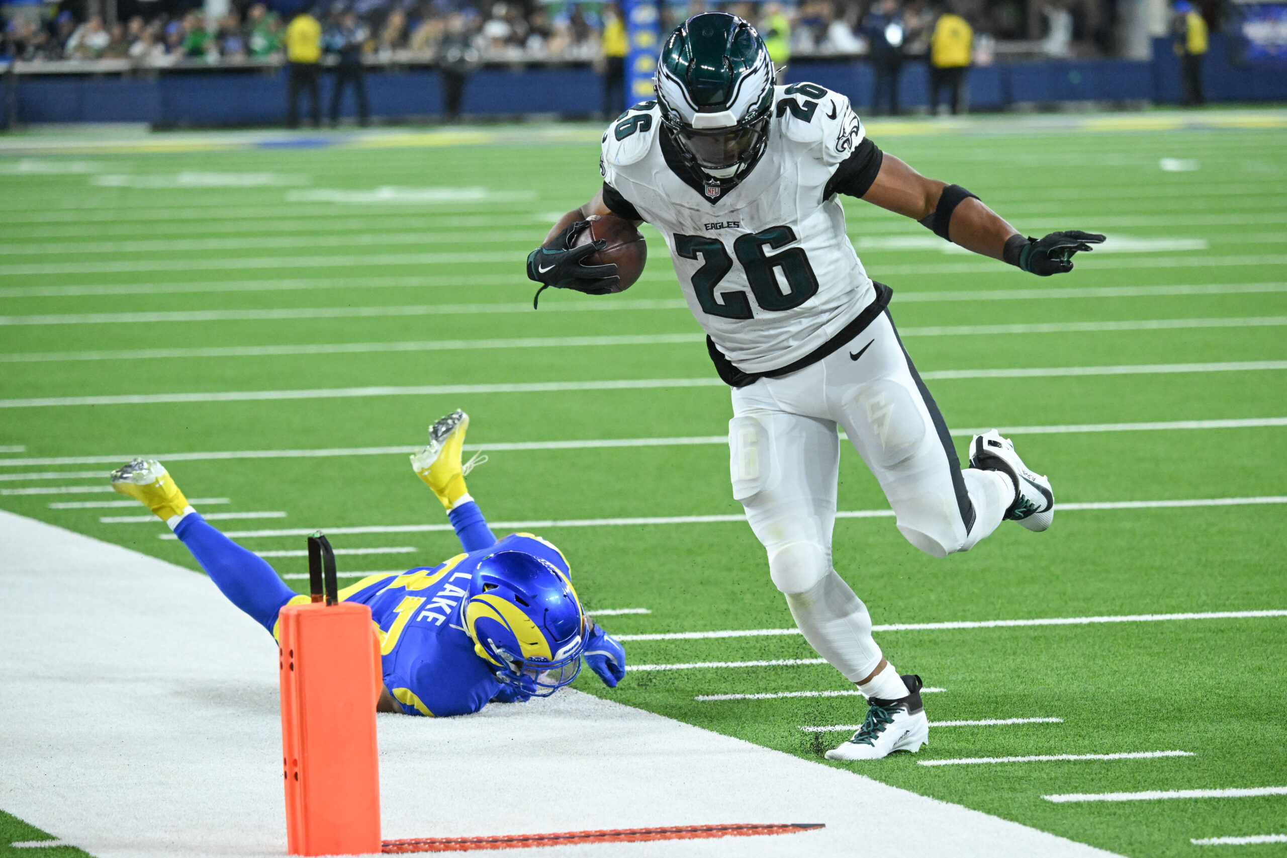 Eagles Saquon Barkley, #26, eludes Rams Quentin Lake, #37, for...