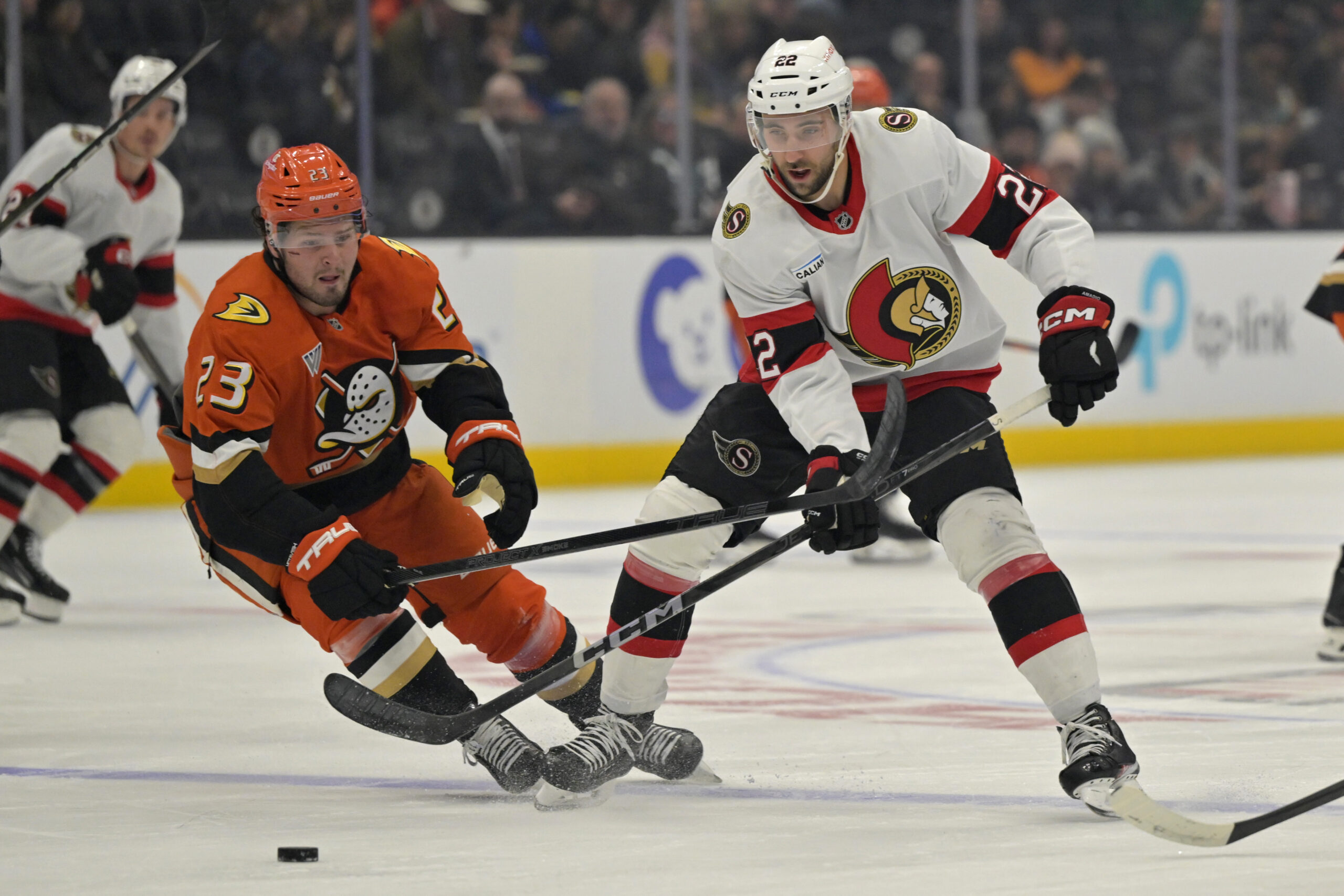 Ducks center Mason McTavish (23) and Ottawa Senators right wing...