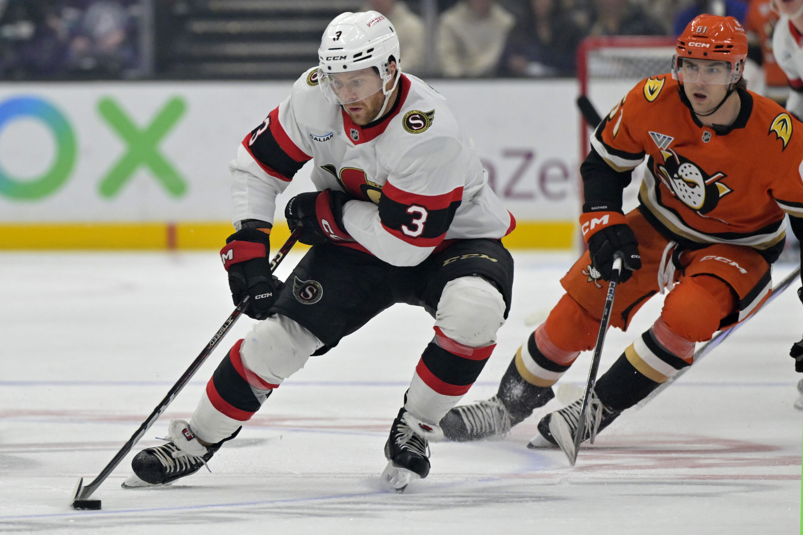 Ottawa Senators defenseman Nick Jensen (3) keeps the puck from...