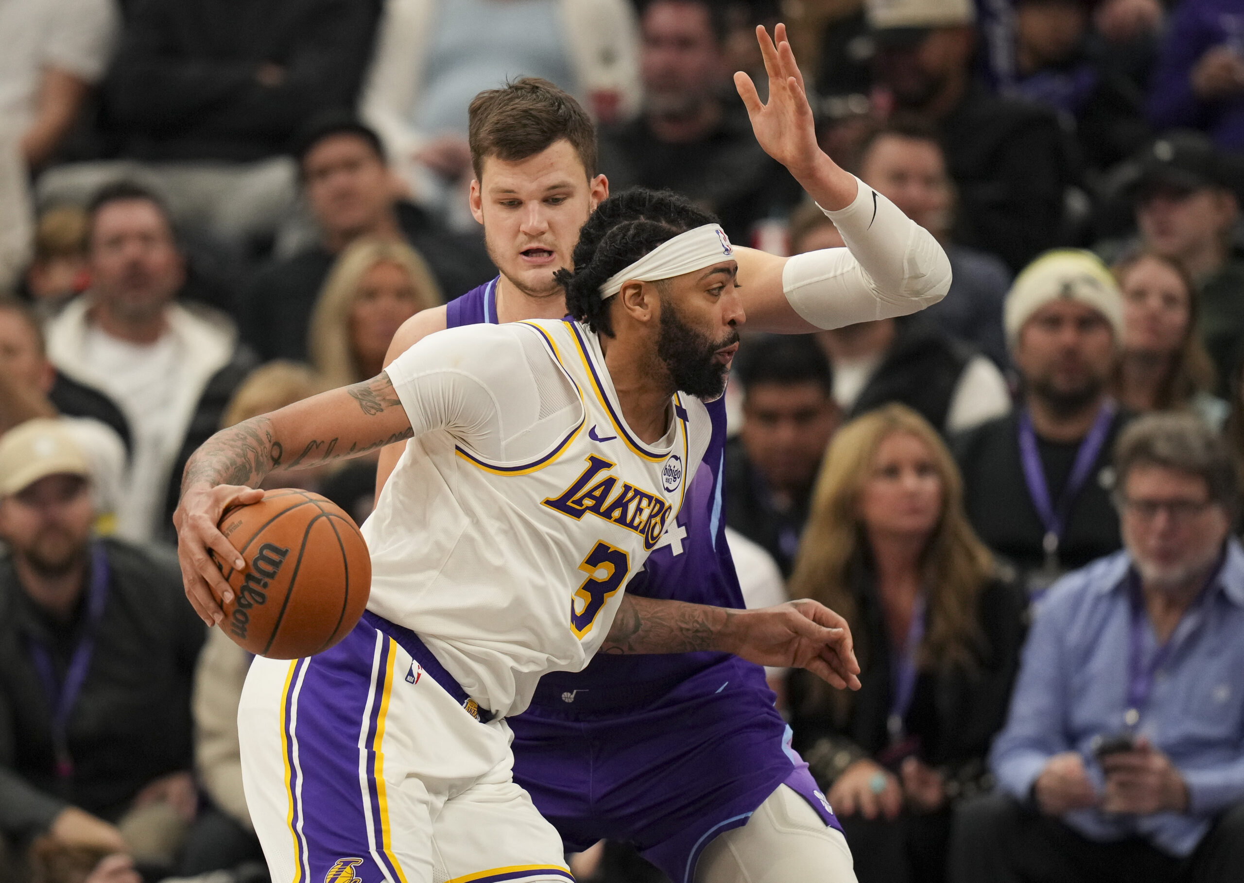 Utah Jazz center Walker Kessler fouls Lakers forward Anthony Davis...