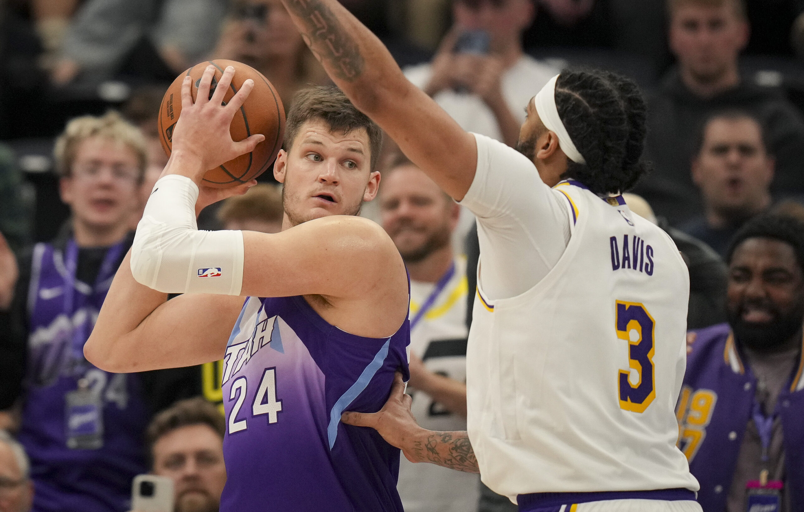 Utah Jazz center Walker Kessler (24) looks to pass a...