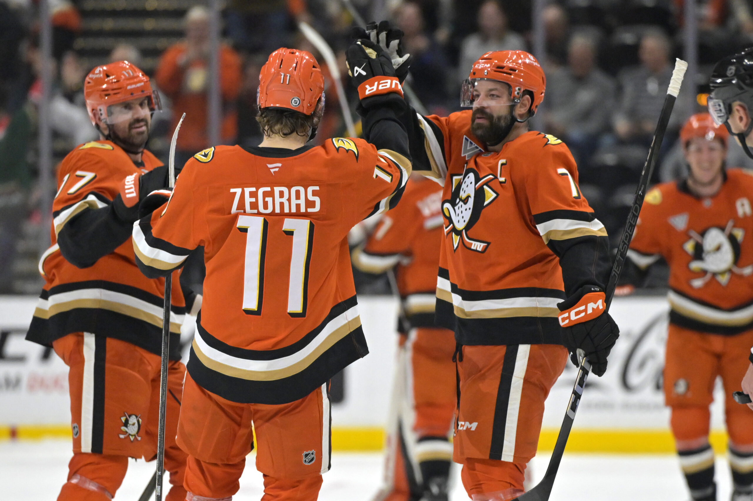 Ducks center Trevor Zegras (11) is congratulated by left wing...