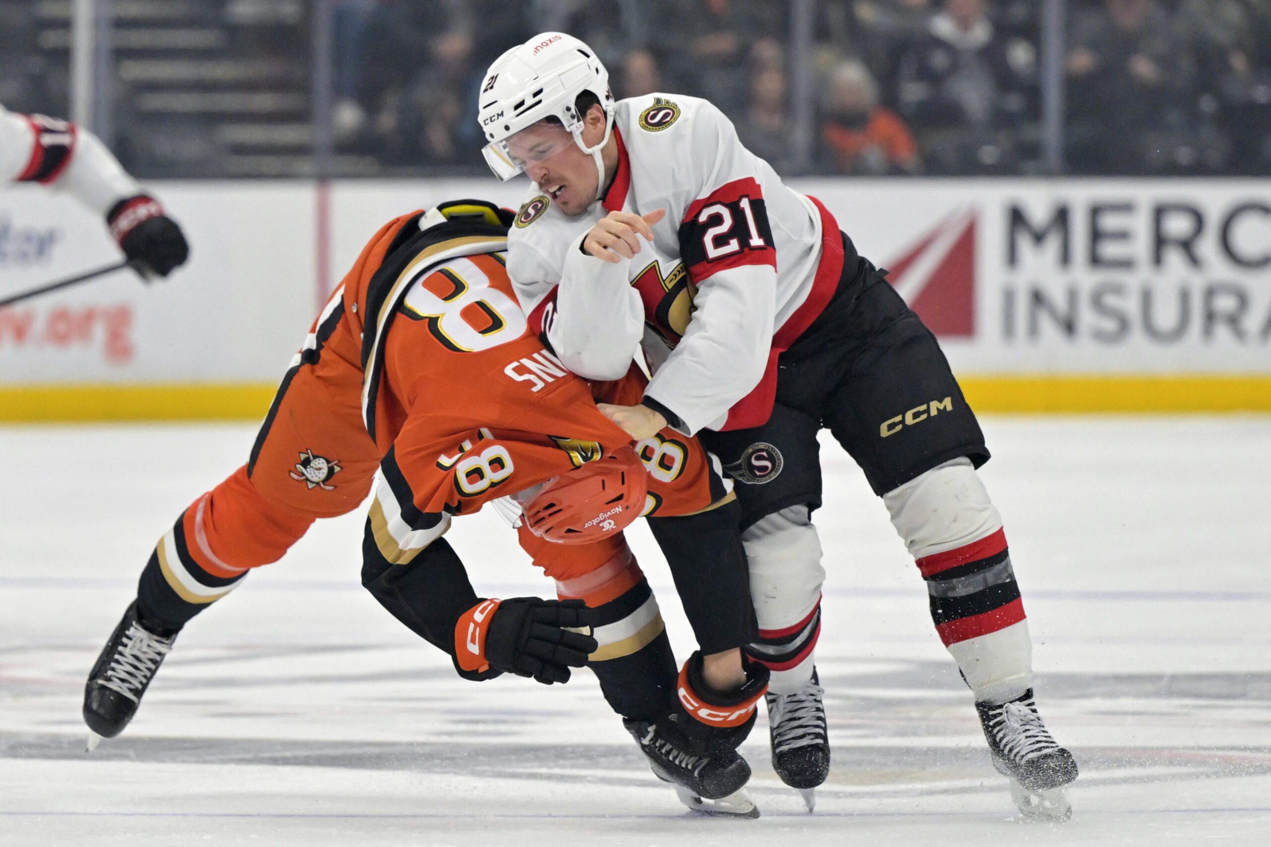 Ducks center Jansen Harkins (38) and Ottawa Senators center Nick...