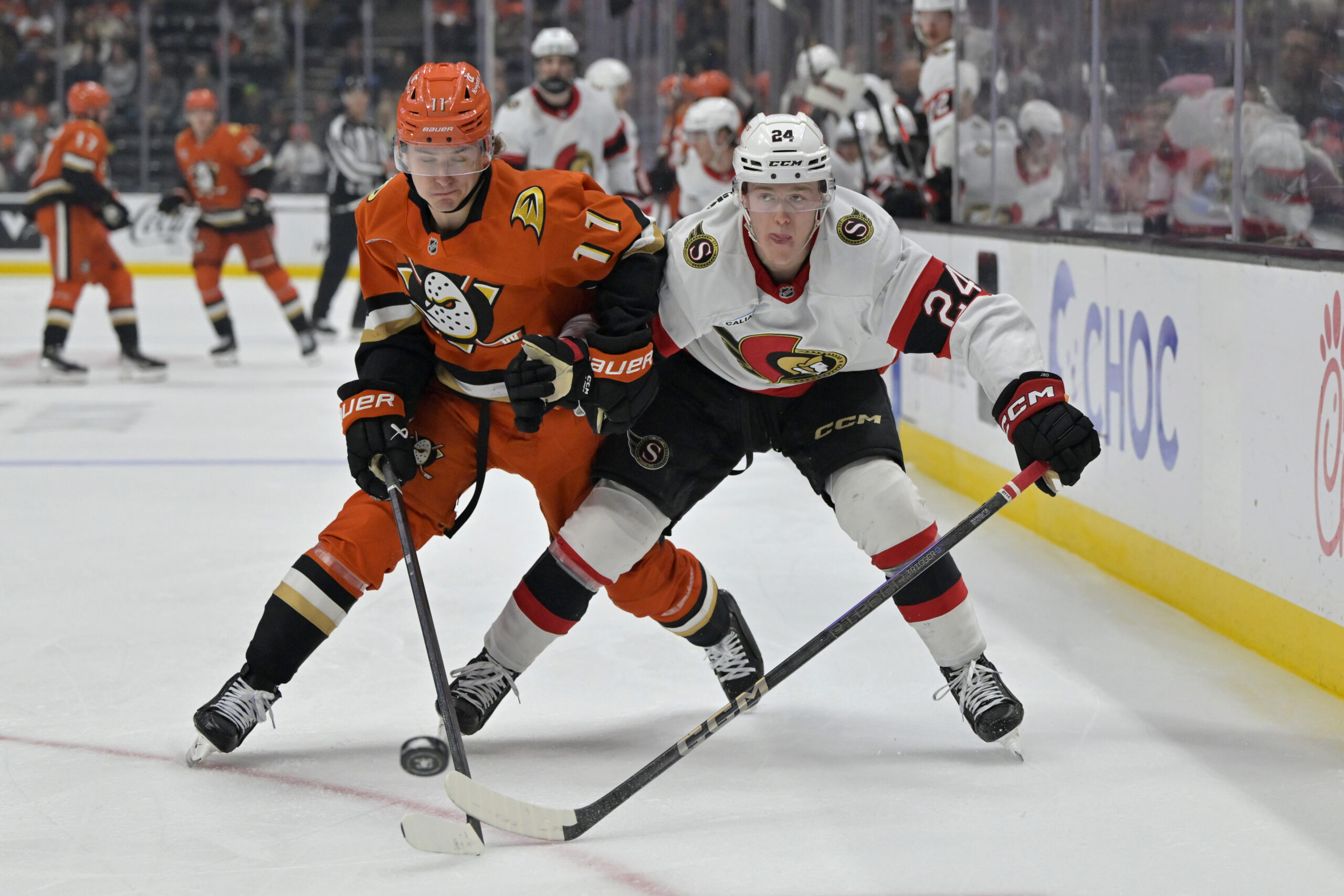 Ducks center Trevor Zegras, left, and Ottawa Senators defenseman Jacob...