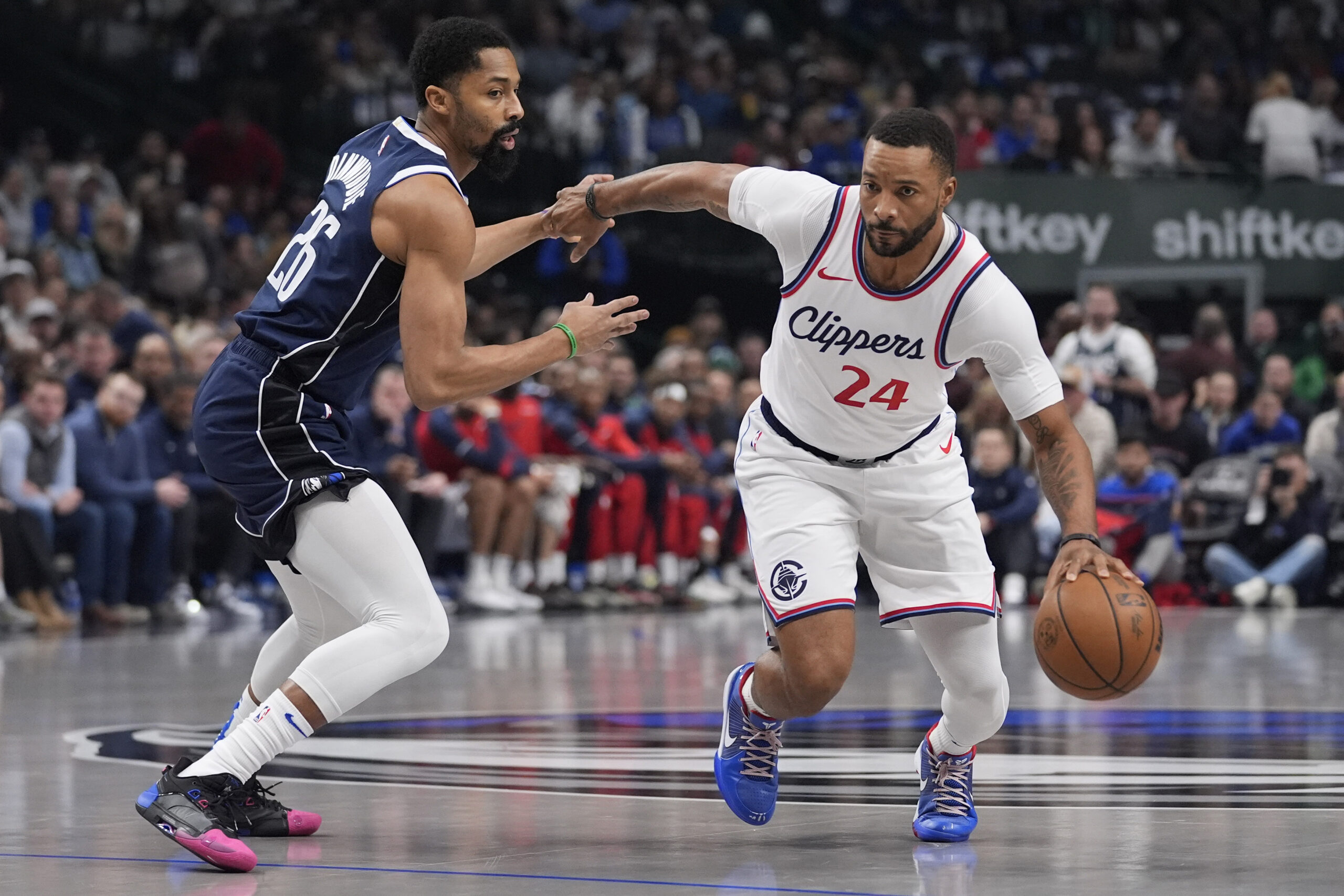 Clippers guard Norman Powell (24) drives against Dallas Mavericks guard...