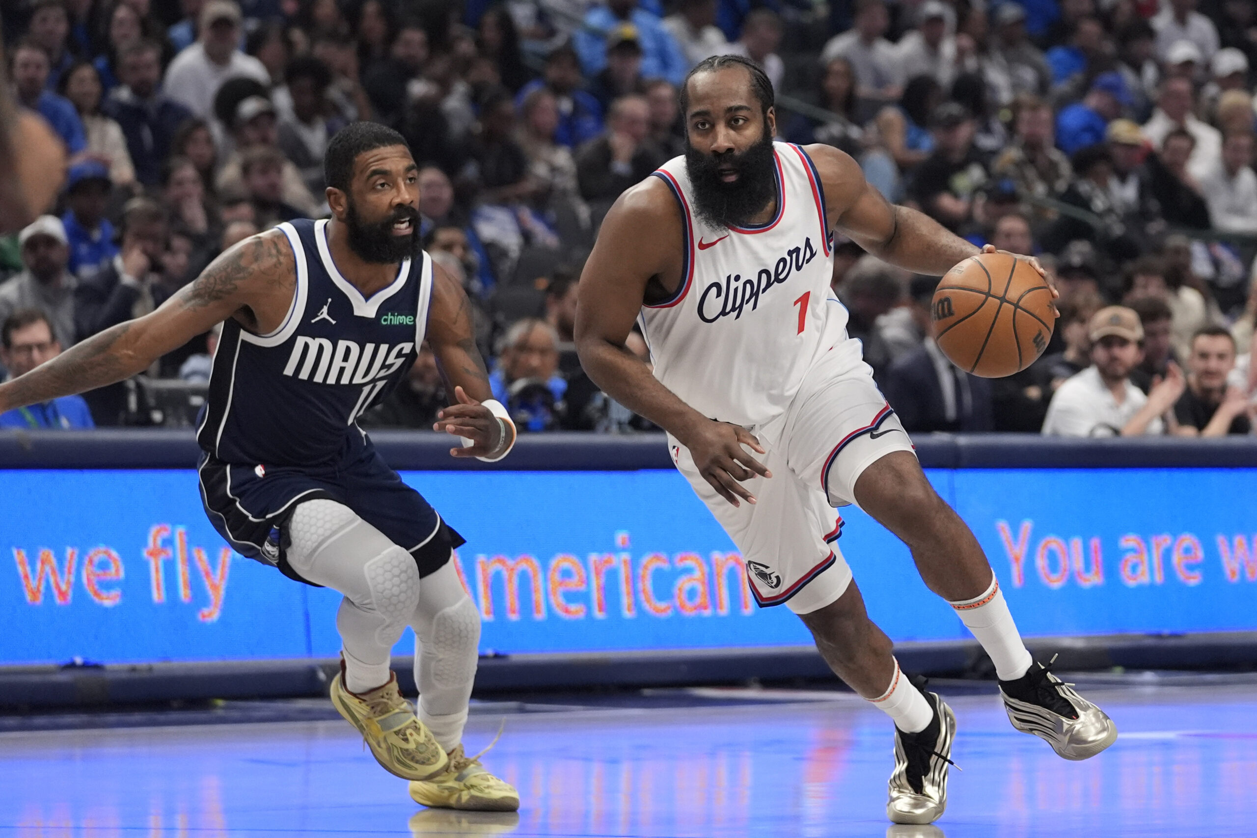 Clippers guard James Harden (1) drives against Dallas Mavericks guard...