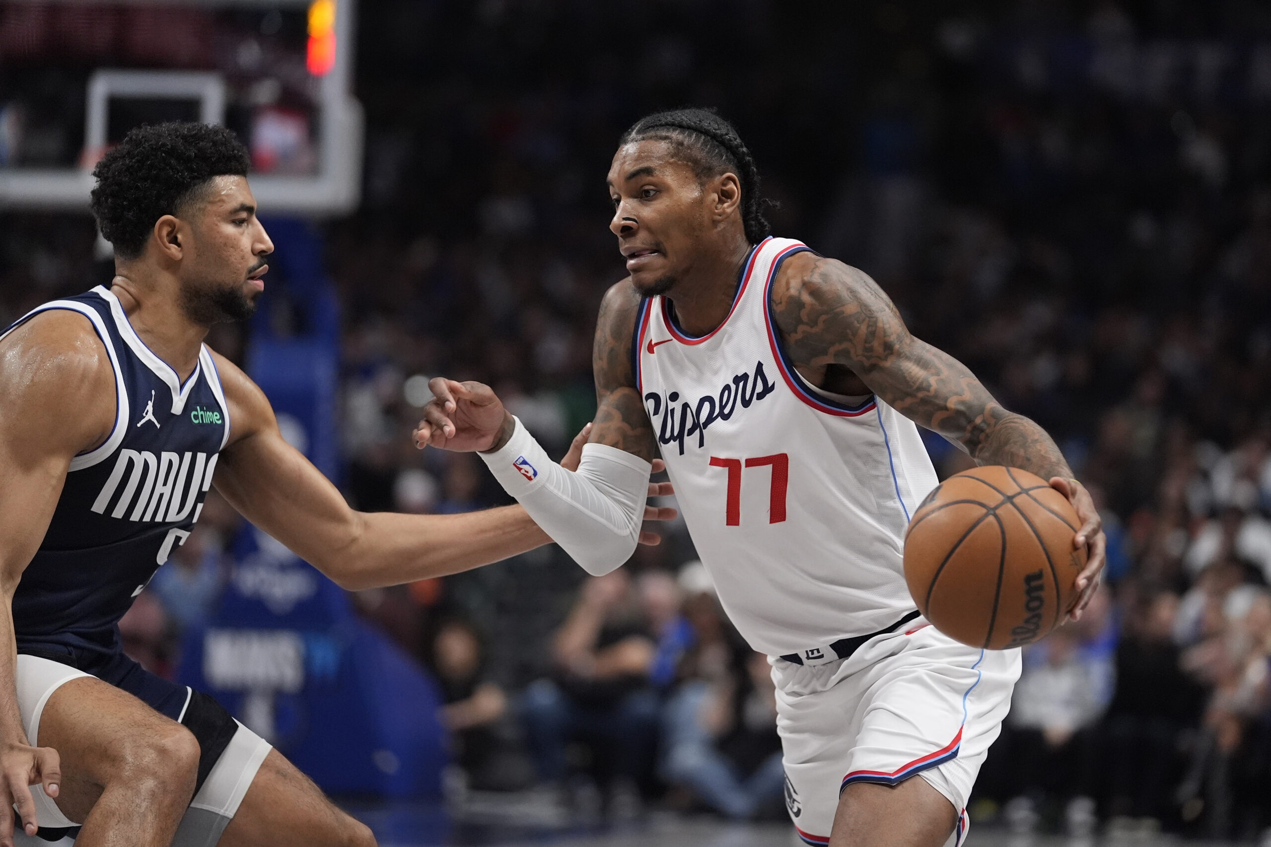 Clippers guard Kevin Porter Jr. (77) dribbles against Dallas Mavericks...