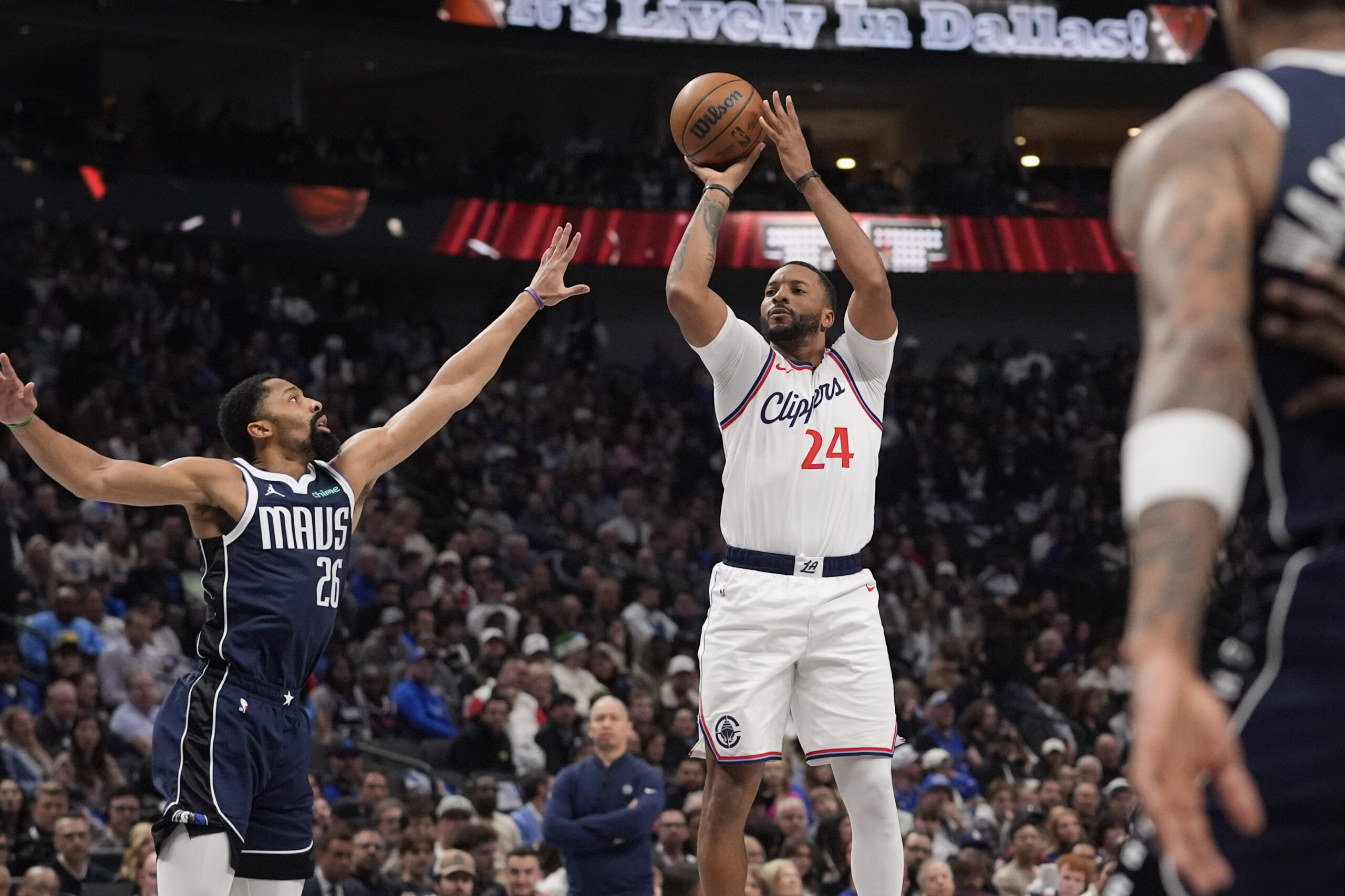 Clippers guard Norman Powell (24) shoots against Dallas Mavericks guard...