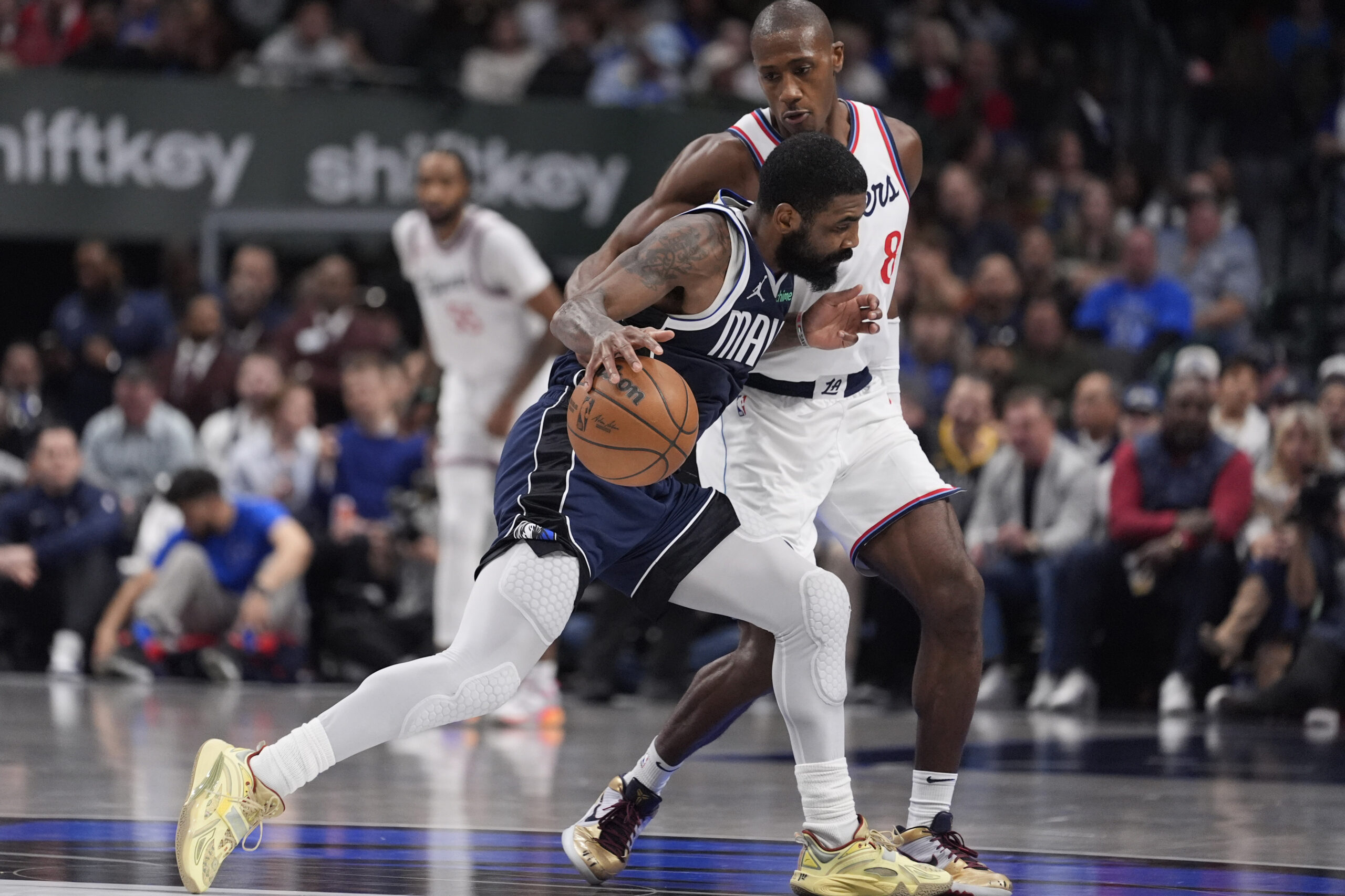 Dallas Mavericks guard Kyrie Irving (11) drives against Clippers guard...