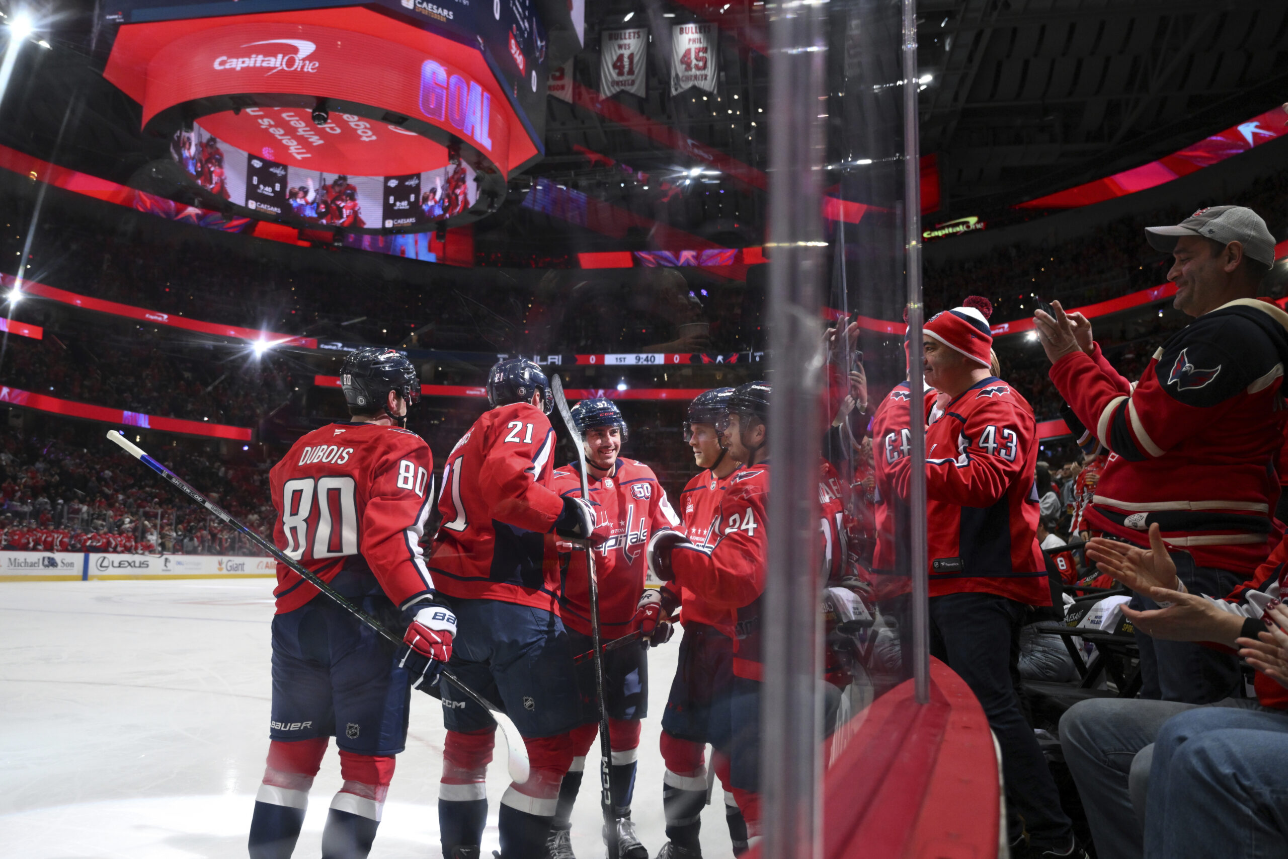 Washington Capitals center Aliaksei Protas (21) celebrates his goal with...