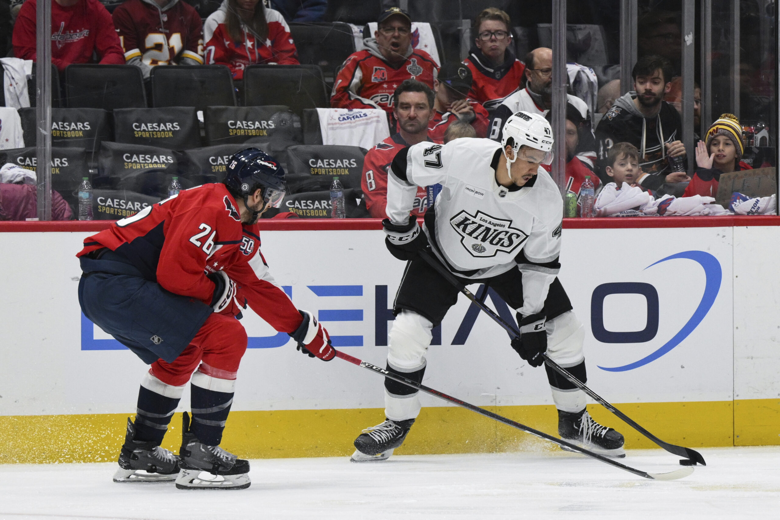 Kings left wing Andre Lee (47) handles the puck as...