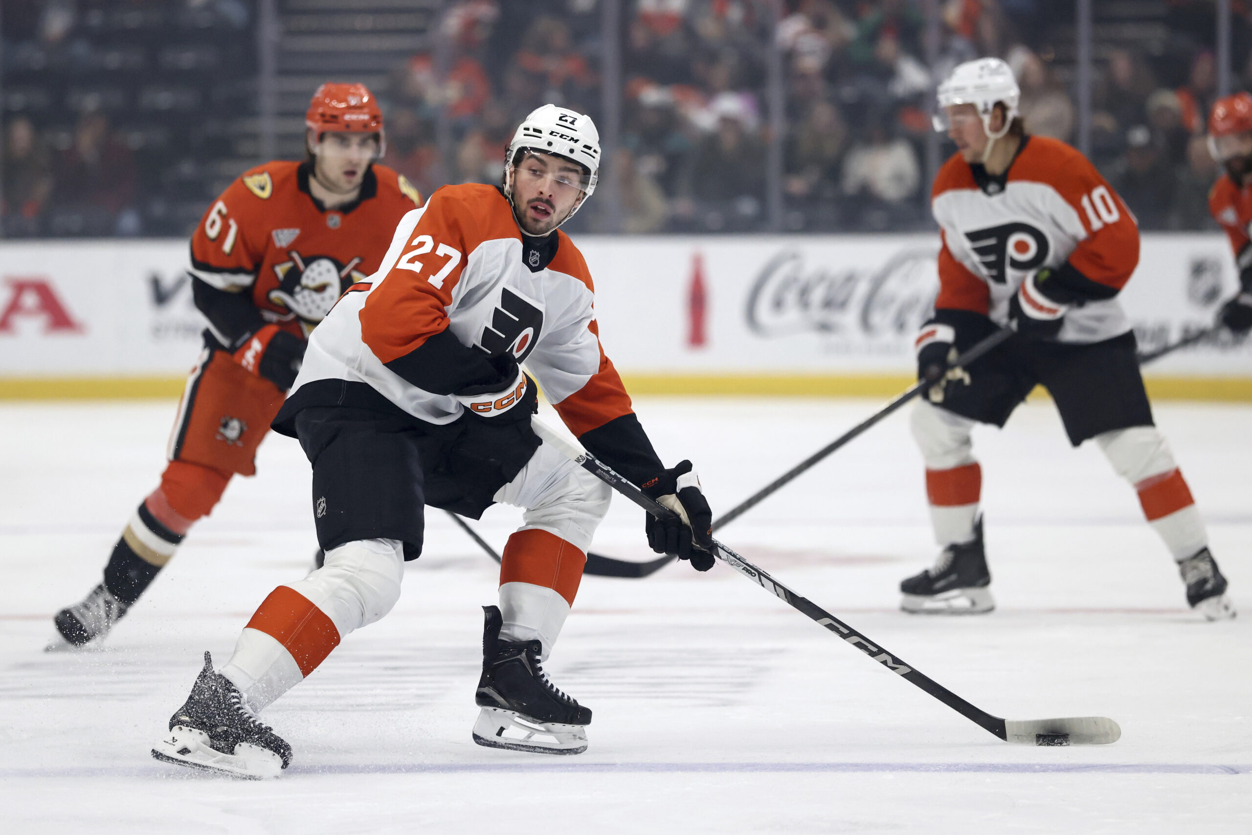 Philadelphia Flyers left wing Noah Cates (27) controls the puck...